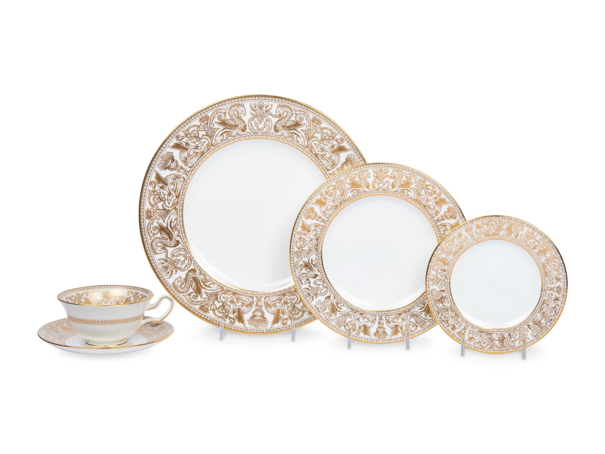 A Wedgwood Gold Florentine Porcelain Dinner Service