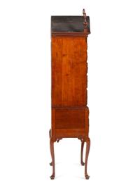 A Queen Anne Fan-Carved Cherrywood Bonnet-Top High Chest