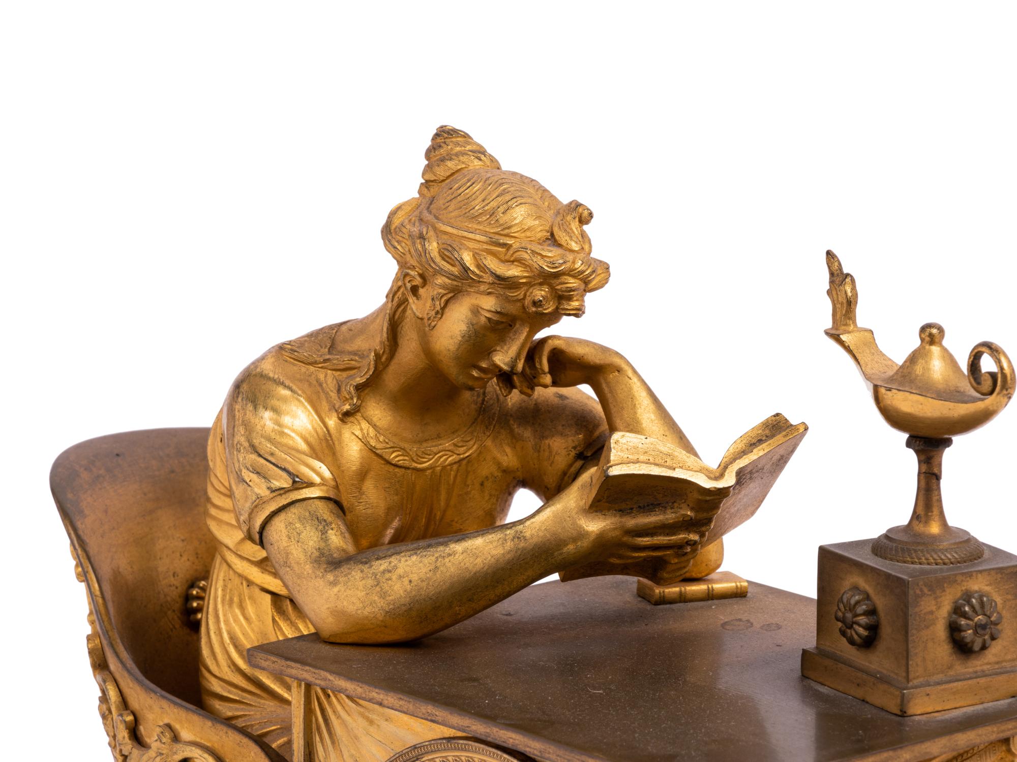 An Empire Gilt Bronze and Marble Figural Mantel Clock