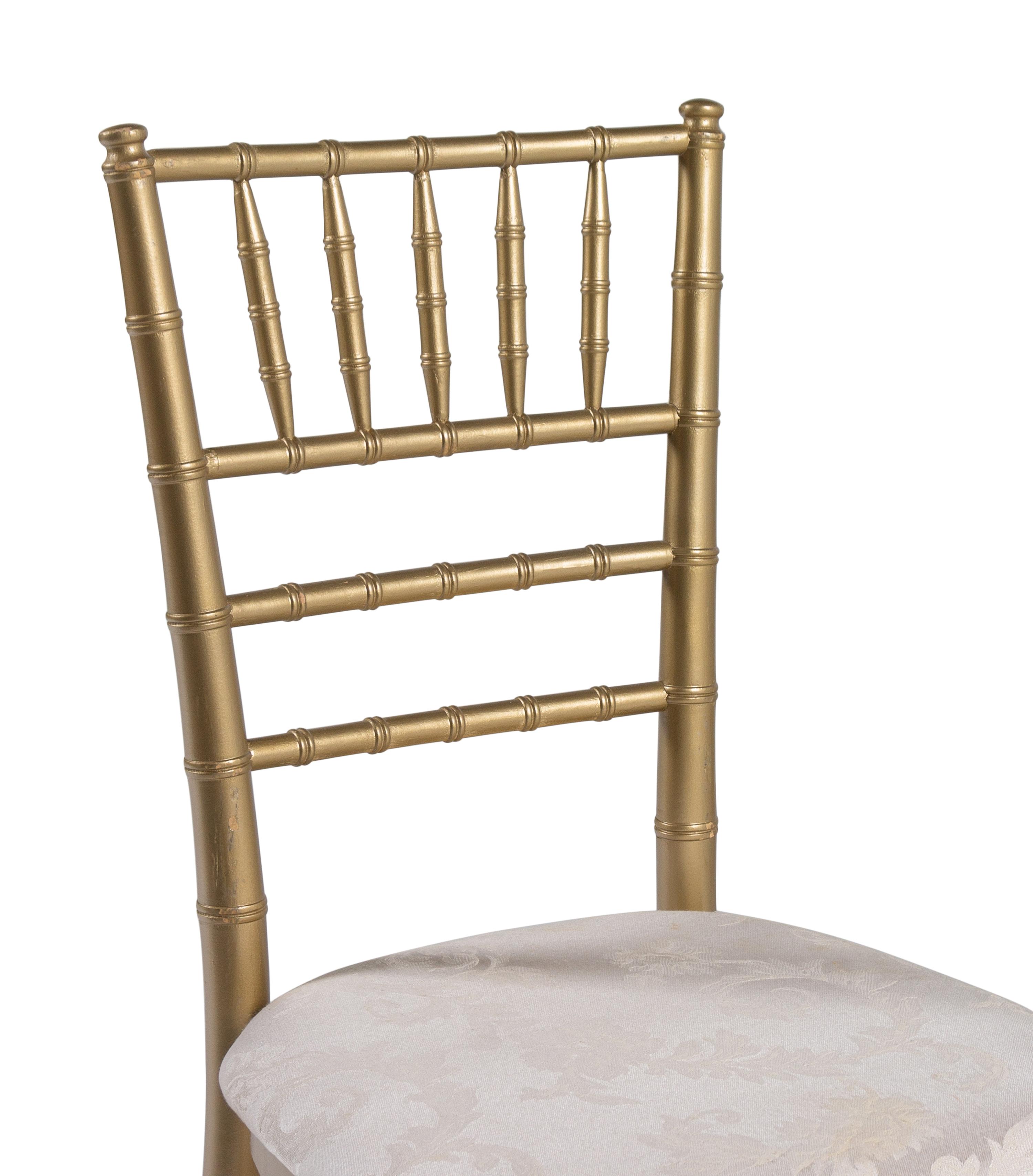 A Set of Thirteen Gold-Painted Ballroom Chairs