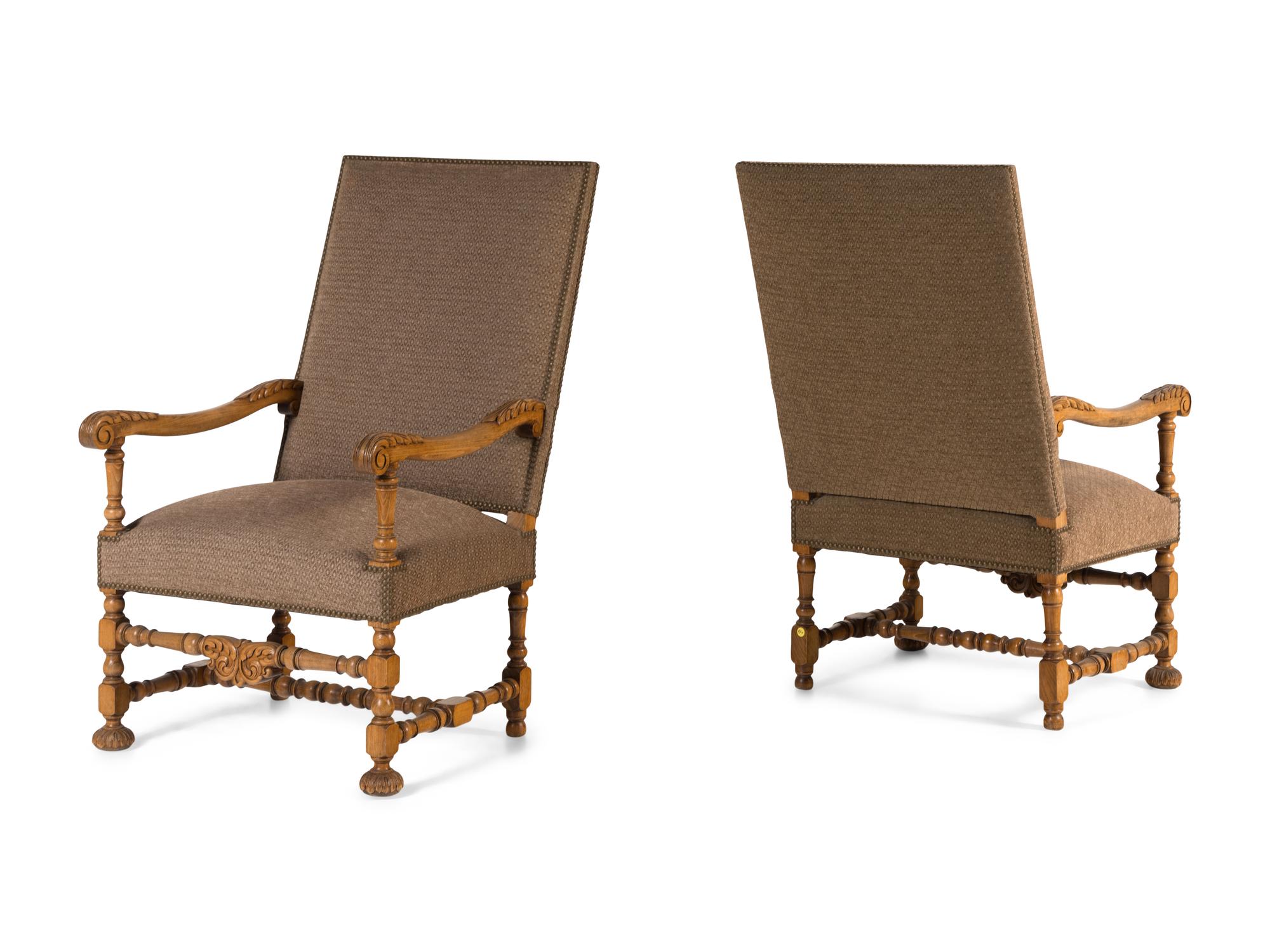 A Pair of Continental Baroque Style Carved Walnut Armchairs