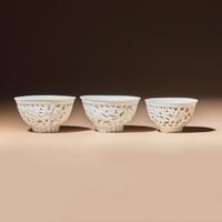Three Chinese Blanc-de-Chine Porcelain Reticulated 'Floral' Cups, Mid 17th-Early 18th Century — 清中期 德化白瓷鏤雕花卉紋杯三隻