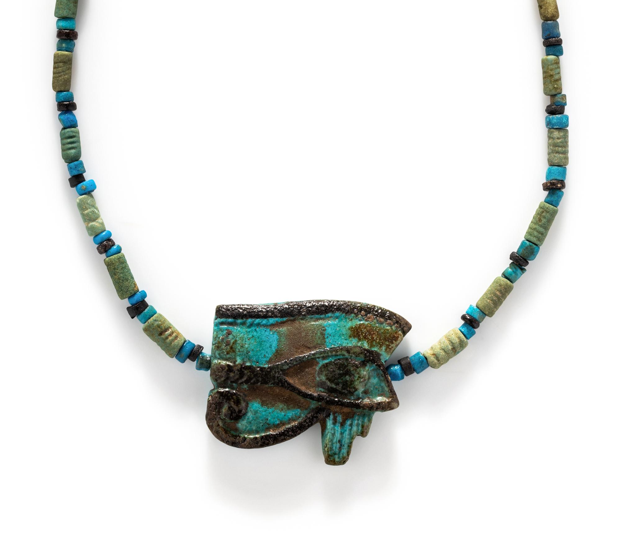 An Egyptian Blue Faience Bead Necklace with a Wadjet
