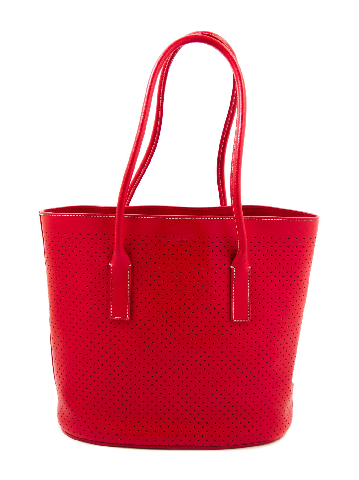 A Prada Red Leather Perforated Tote Bag, 11" x 9" x 3.5"; Handle drop: 7.5".