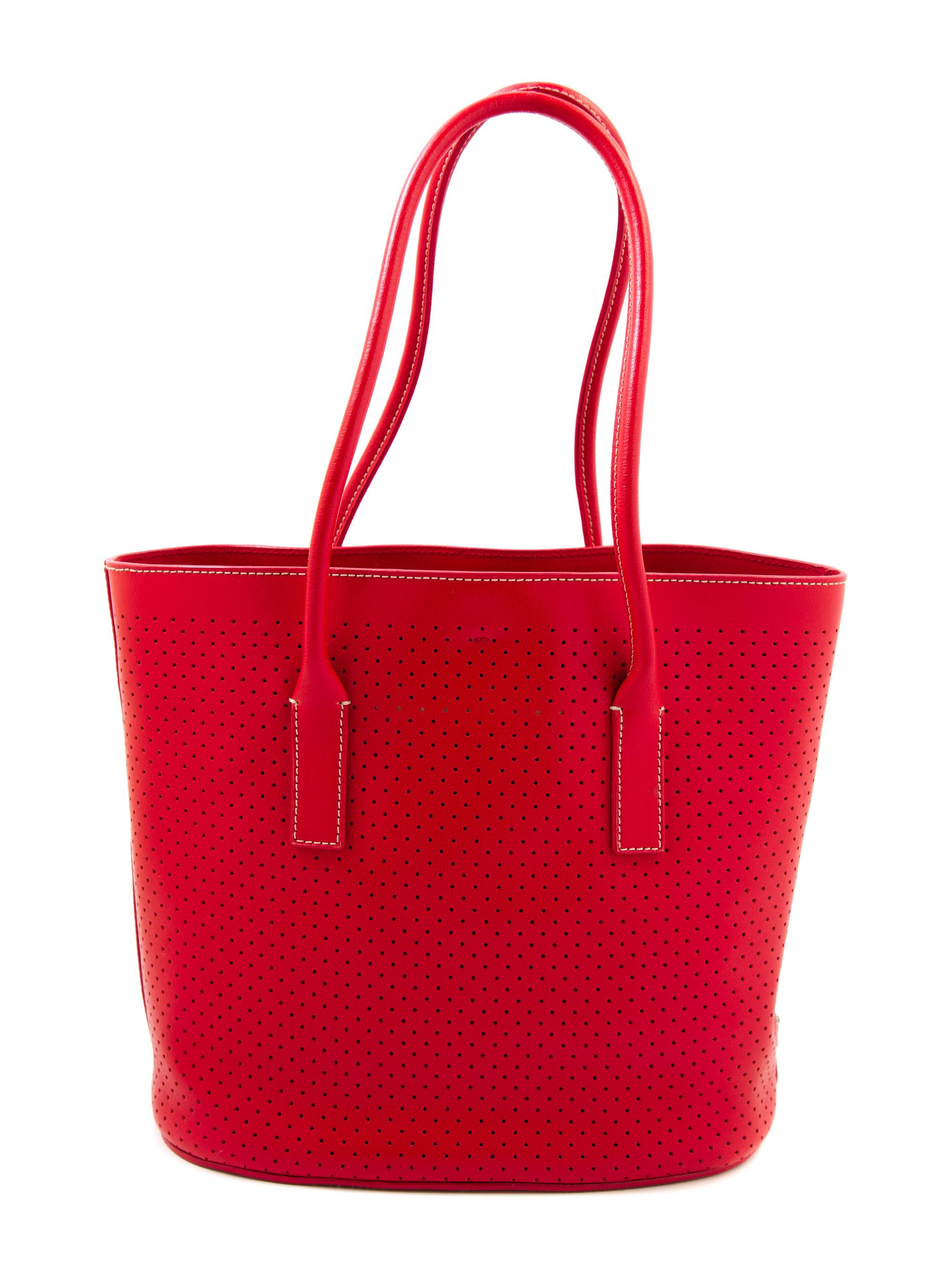 A Prada Red Leather Perforated Tote Bag, 11" x 9" x 3.5"; Handle drop: 7.5".