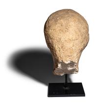 An Egyptian Painted Limestone Head of a Youth