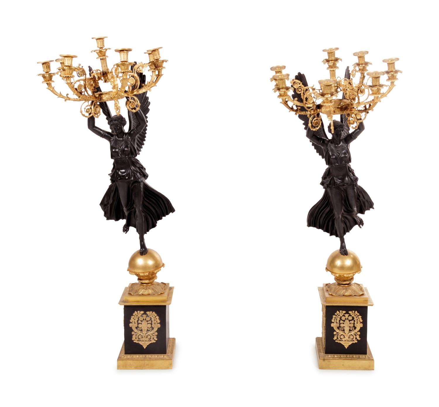 A Pair of Empire Style Gilt and Patinated Cast Metal Seven-Light Torchères