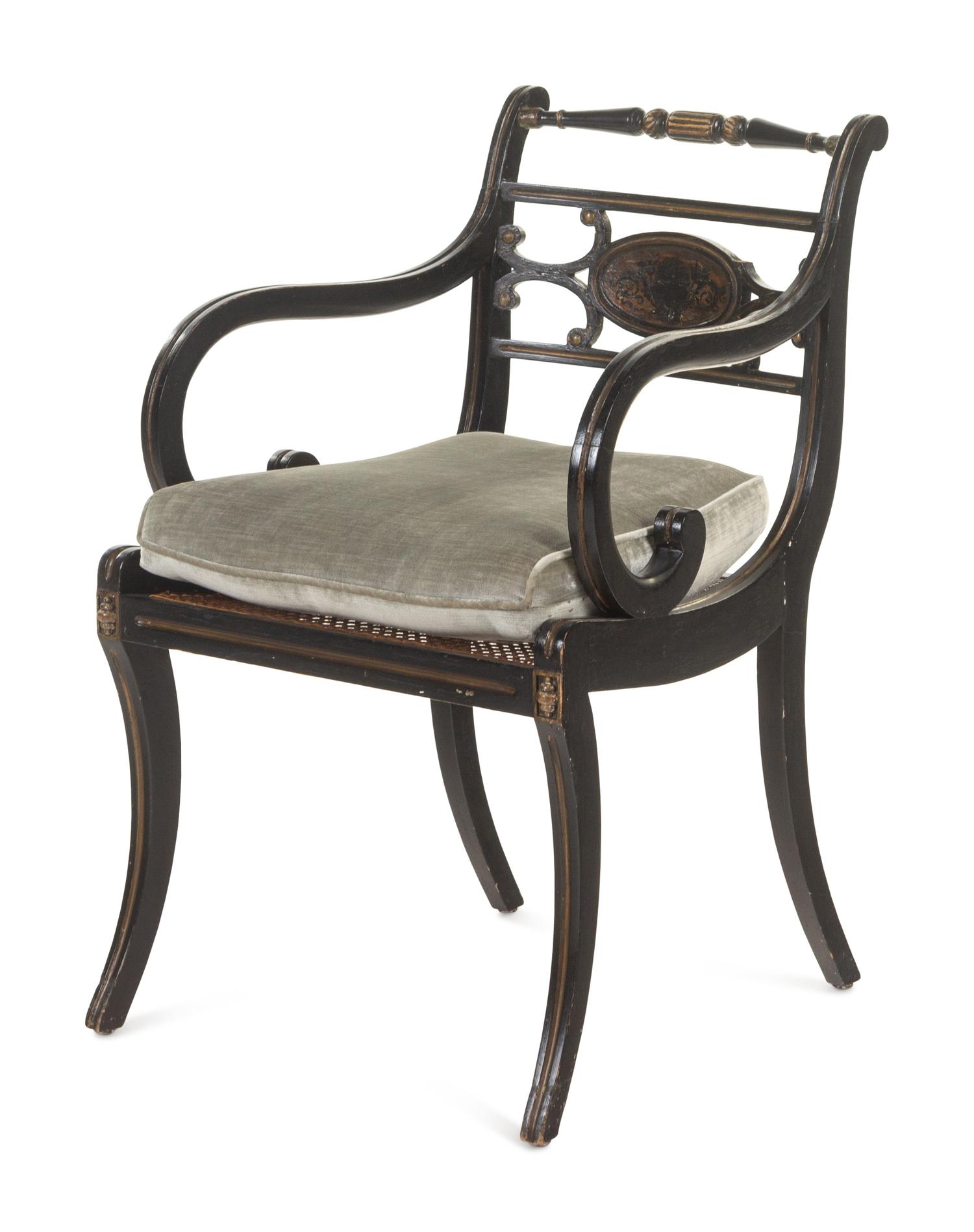A Regency Painted and Parcel-Gilt Cane Seat Armchair