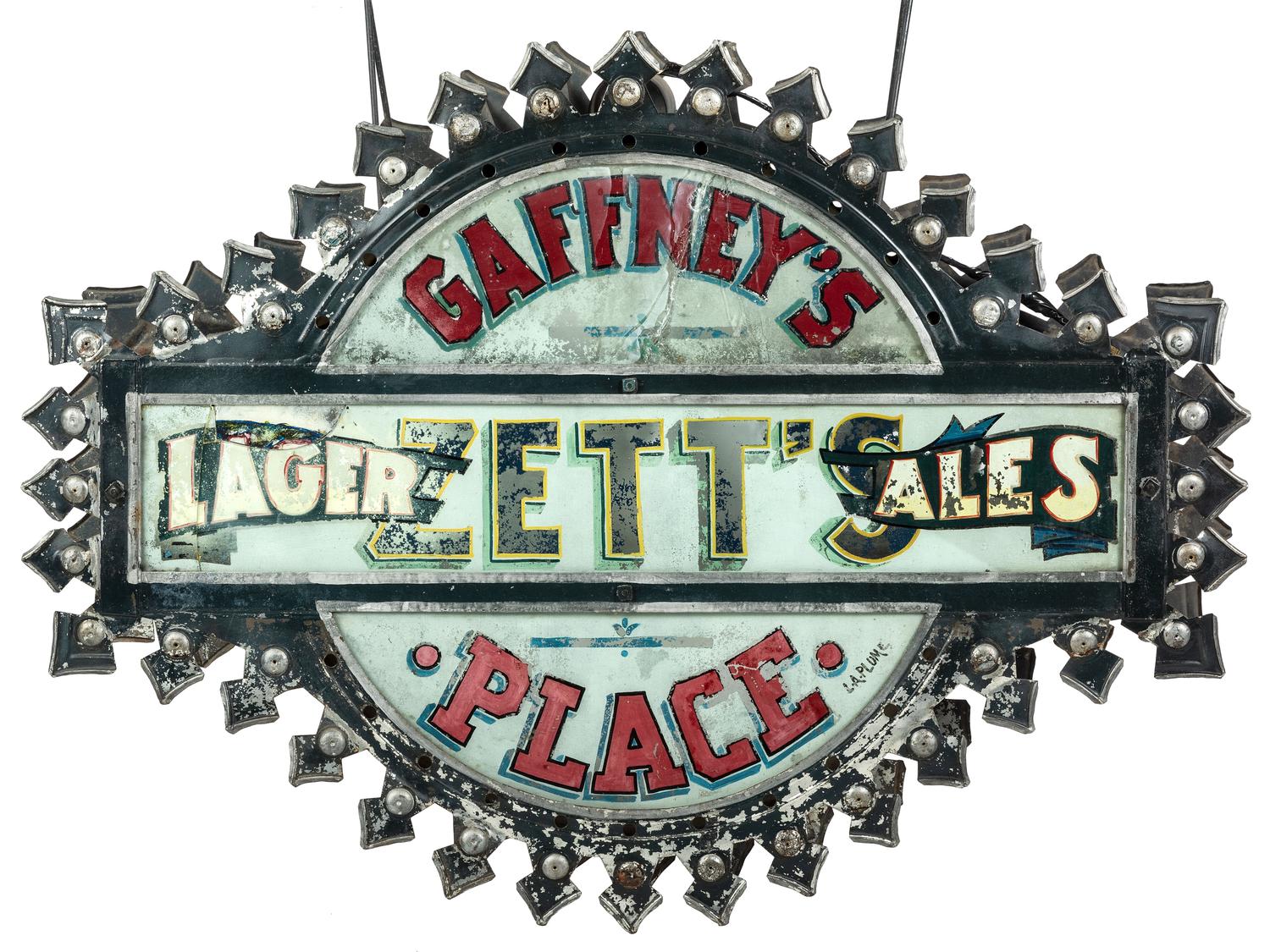 A Zett's Lager and Ales Reverse Painted Glass and Pressed Metal Double-Sided Lighted Bar Sign