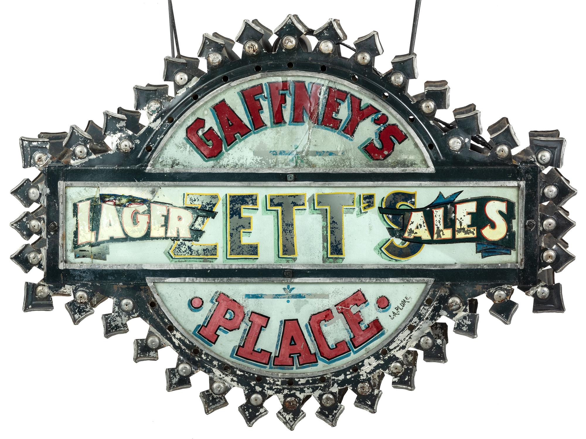 A Zett's Lager and Ales Reverse Painted Glass and Pressed Metal Double-Sided Lighted Bar Sign