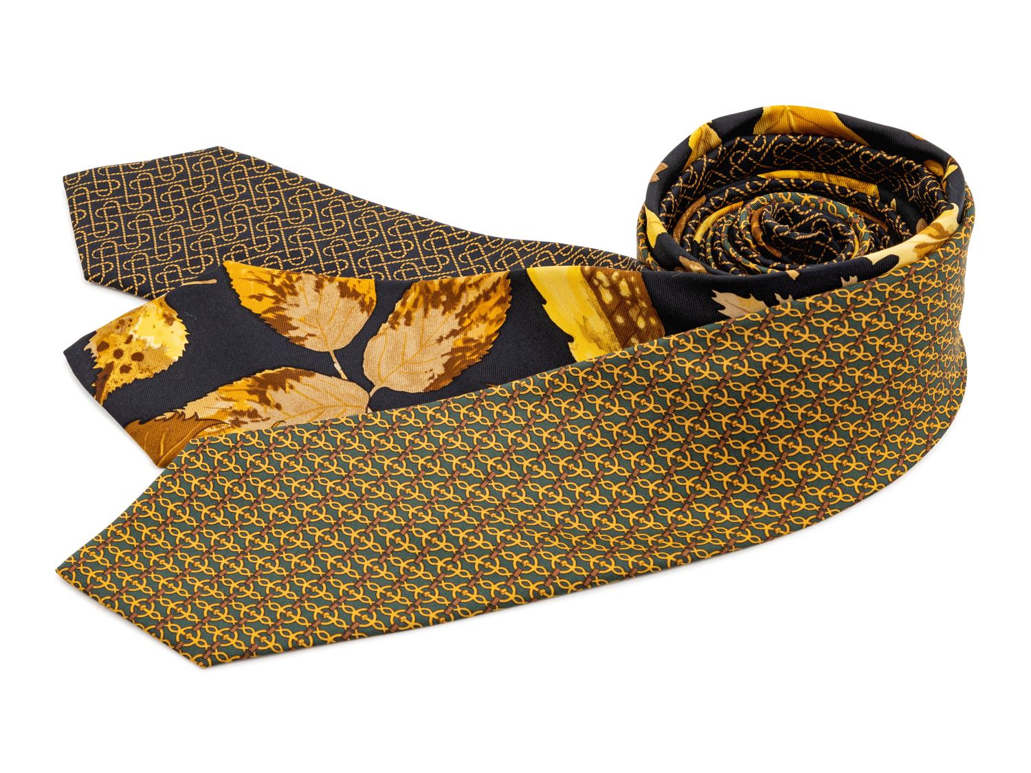 Three Hermes ties, two black with yellow pattern, one green