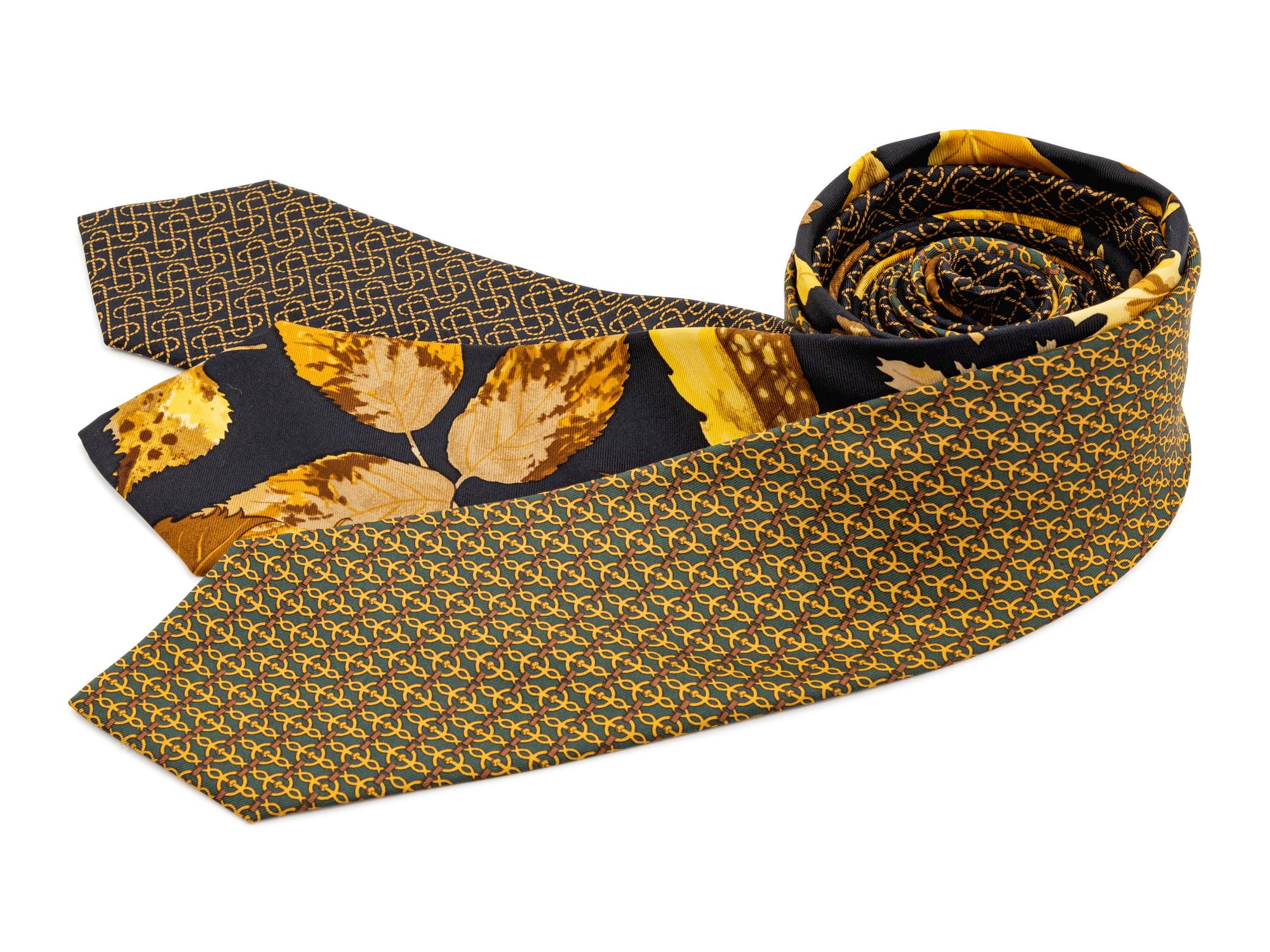 Three Hermes ties, two black with yellow pattern, one green