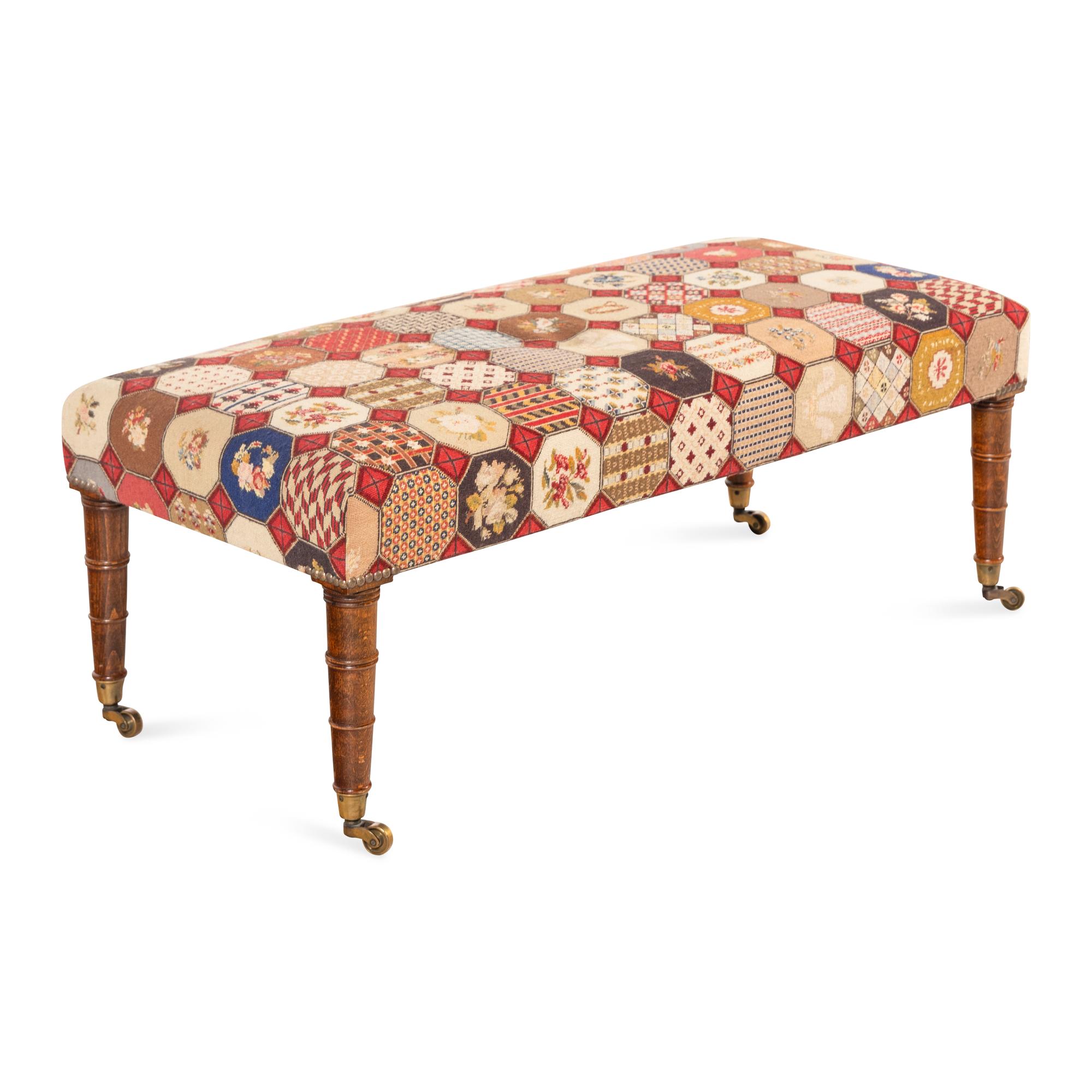 An English Mahogany and Needlepoint Upholstered Ottoman