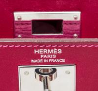 An Hermes Rubis and Rose Tyrien Candy Tadelakt and Chevre Retorne 28cm Kelly Handbag, 11" x 8.5" x 4".