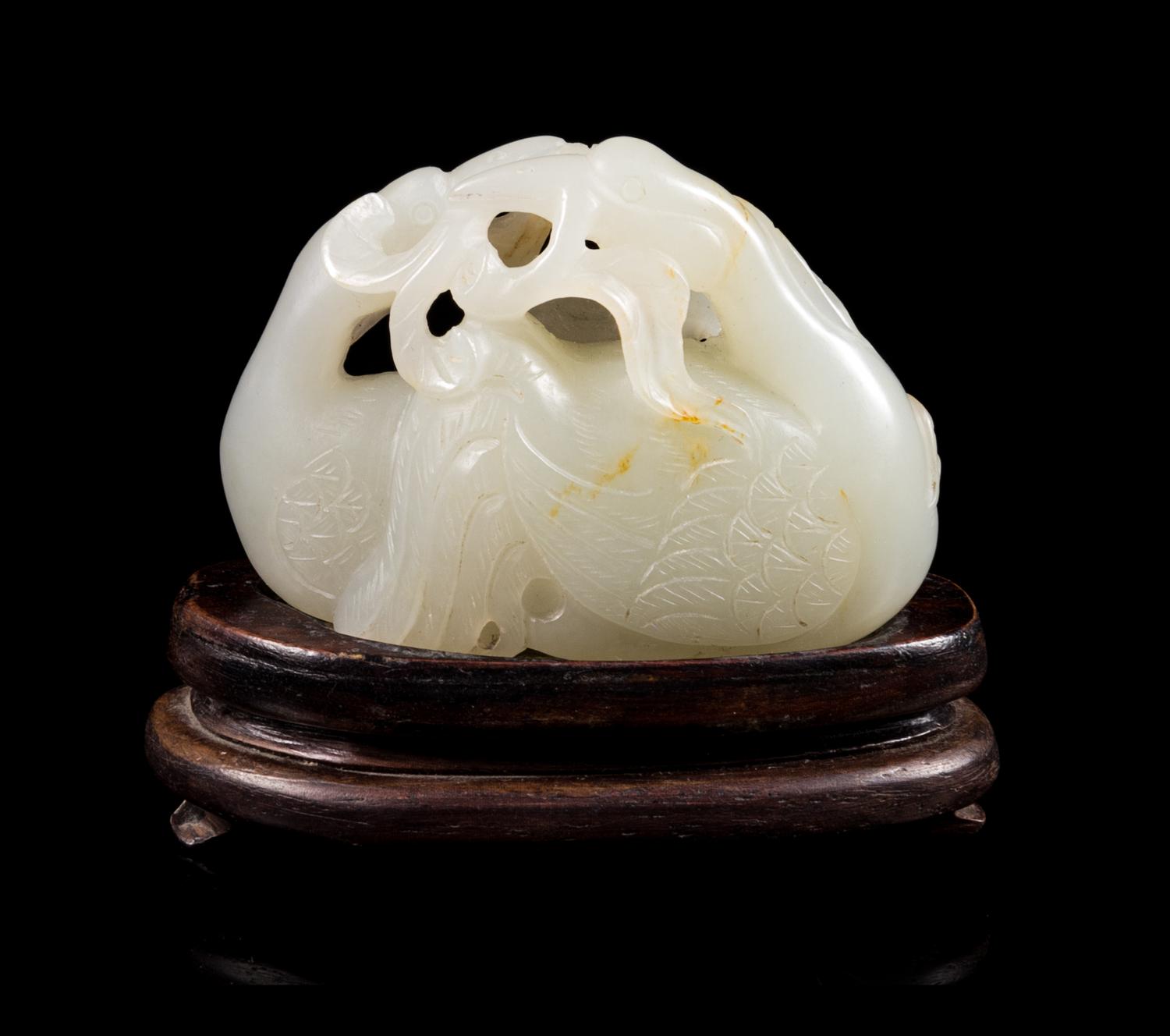 A White and Russet Jade Carving Length of jade 2 1/8 x width 1 1/2 inches. — 18TH/19TH CENTURY