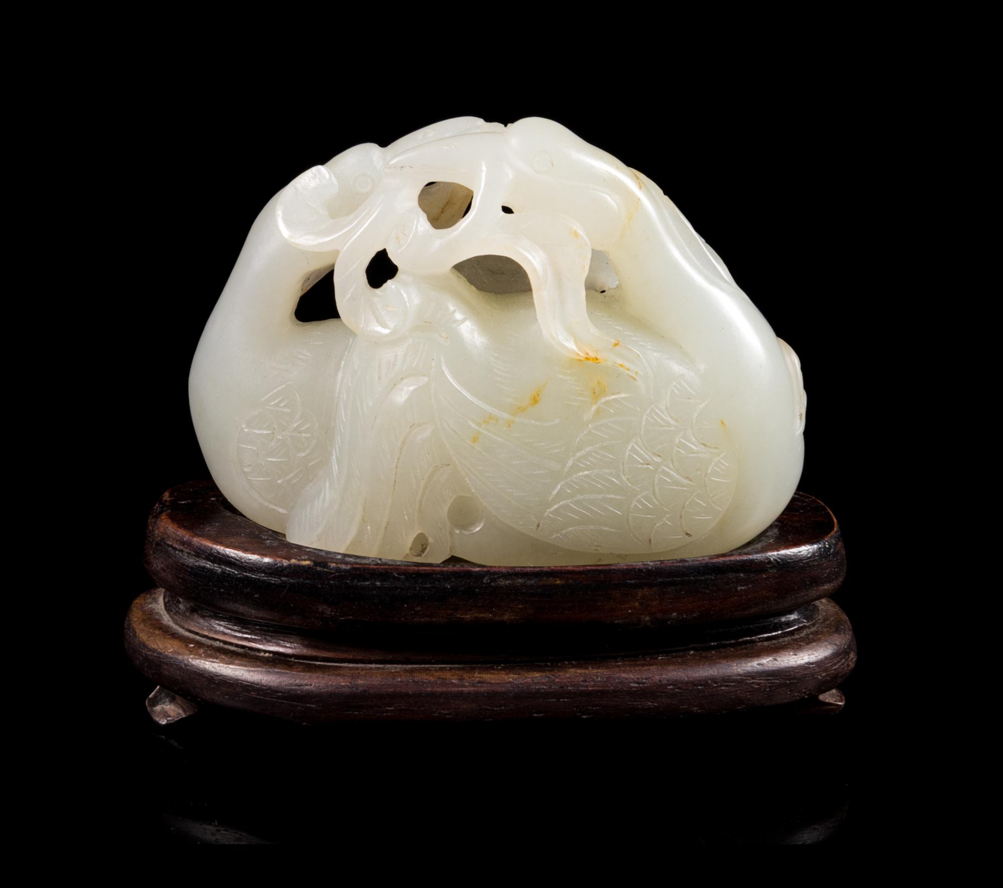 A White and Russet Jade Carving Length of jade 2 1/8 x width 1 1/2 inches. — 18TH/19TH CENTURY