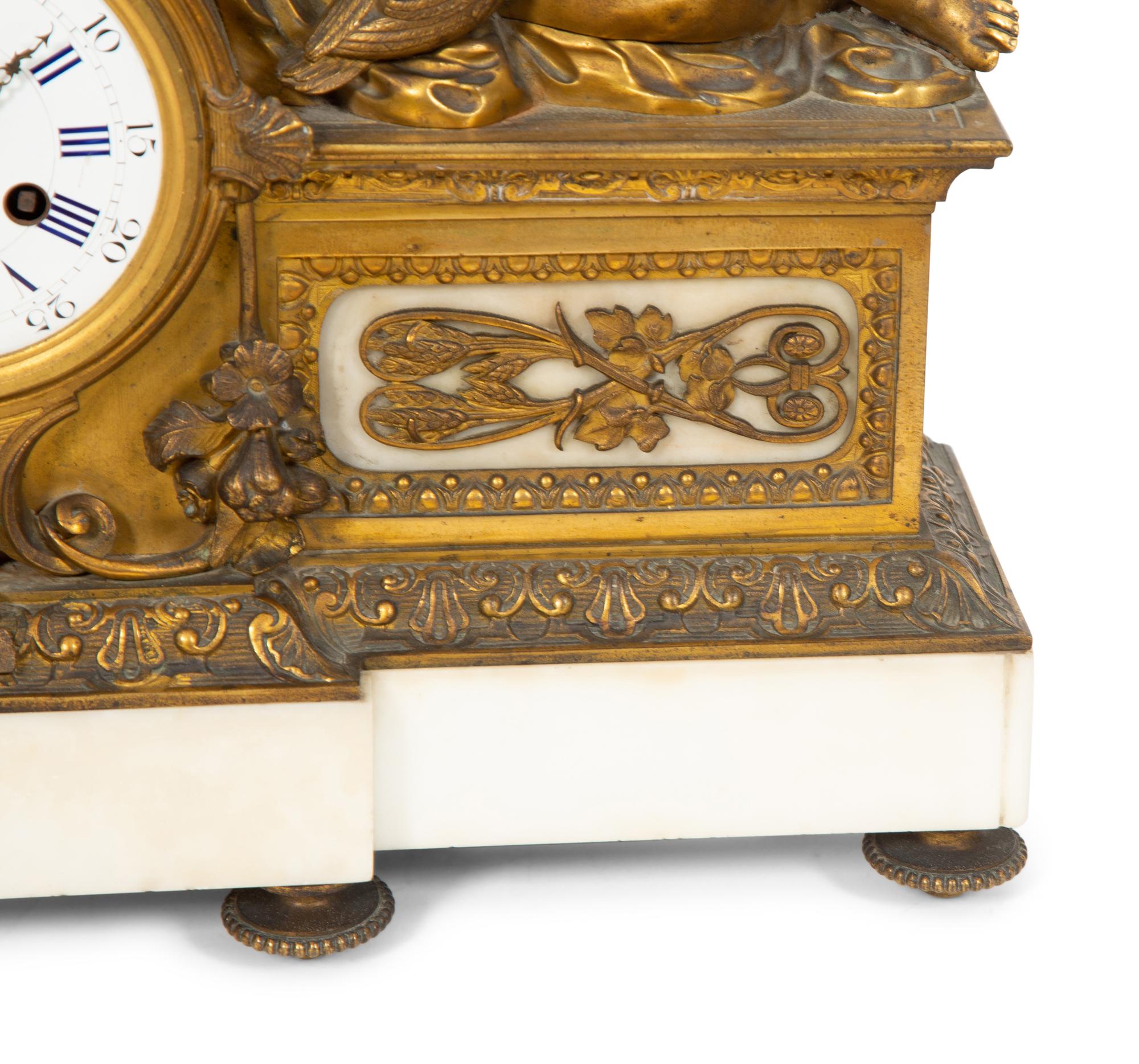 A Louis XV Style Gilt Bronze and Marble Mantel Clock