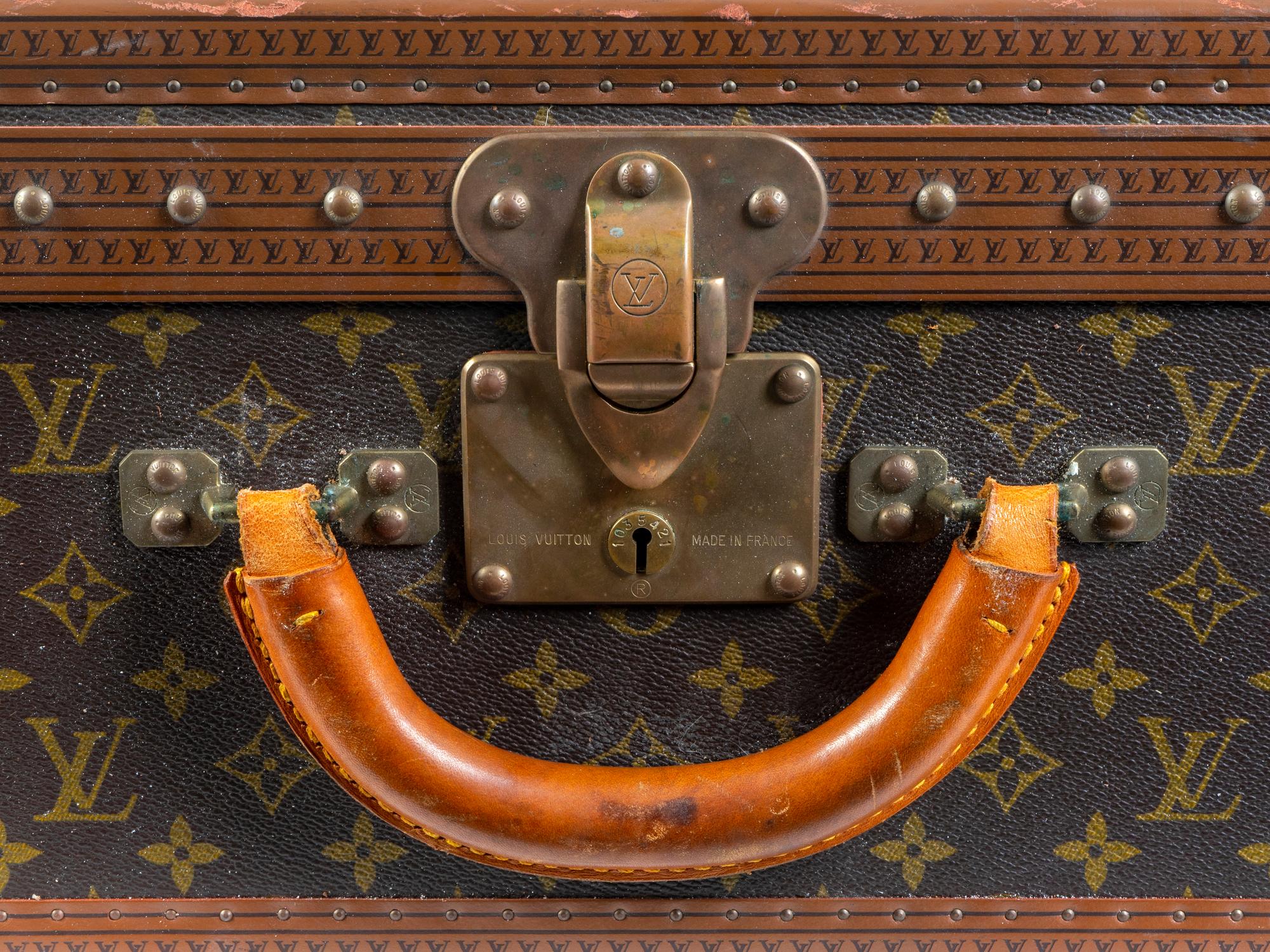 A Louis Vuitton Monogram Canvas Hardside Suitcase. — 20TH CENTURY