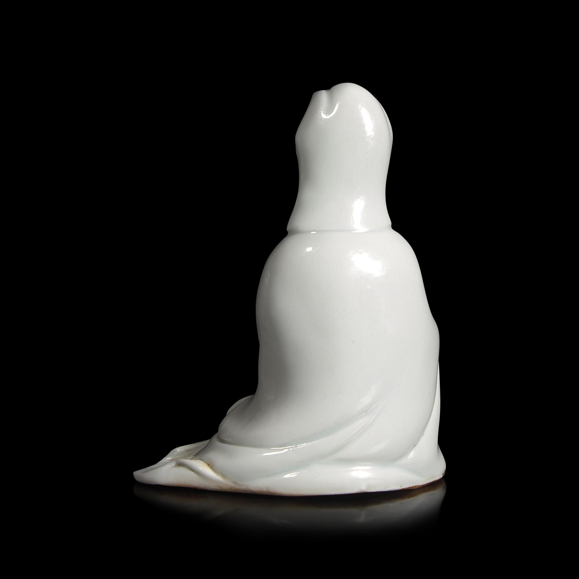 A Small Chinese Porcelain Figure of Guanyin, Qing Dynasty — 清 德化白瓷觀音坐像