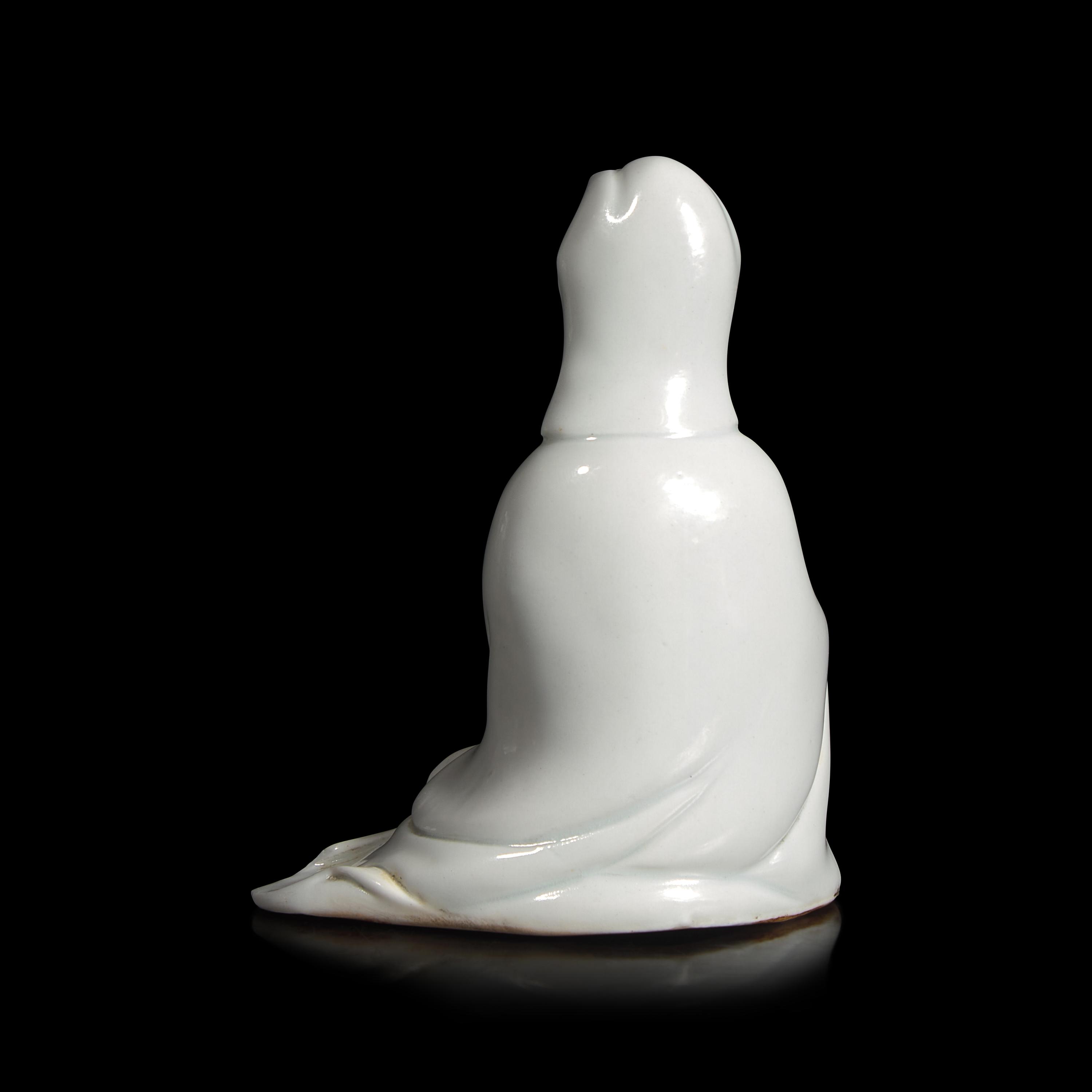 A Small Chinese Porcelain Figure of Guanyin, Qing Dynasty — 清 德化白瓷觀音坐像