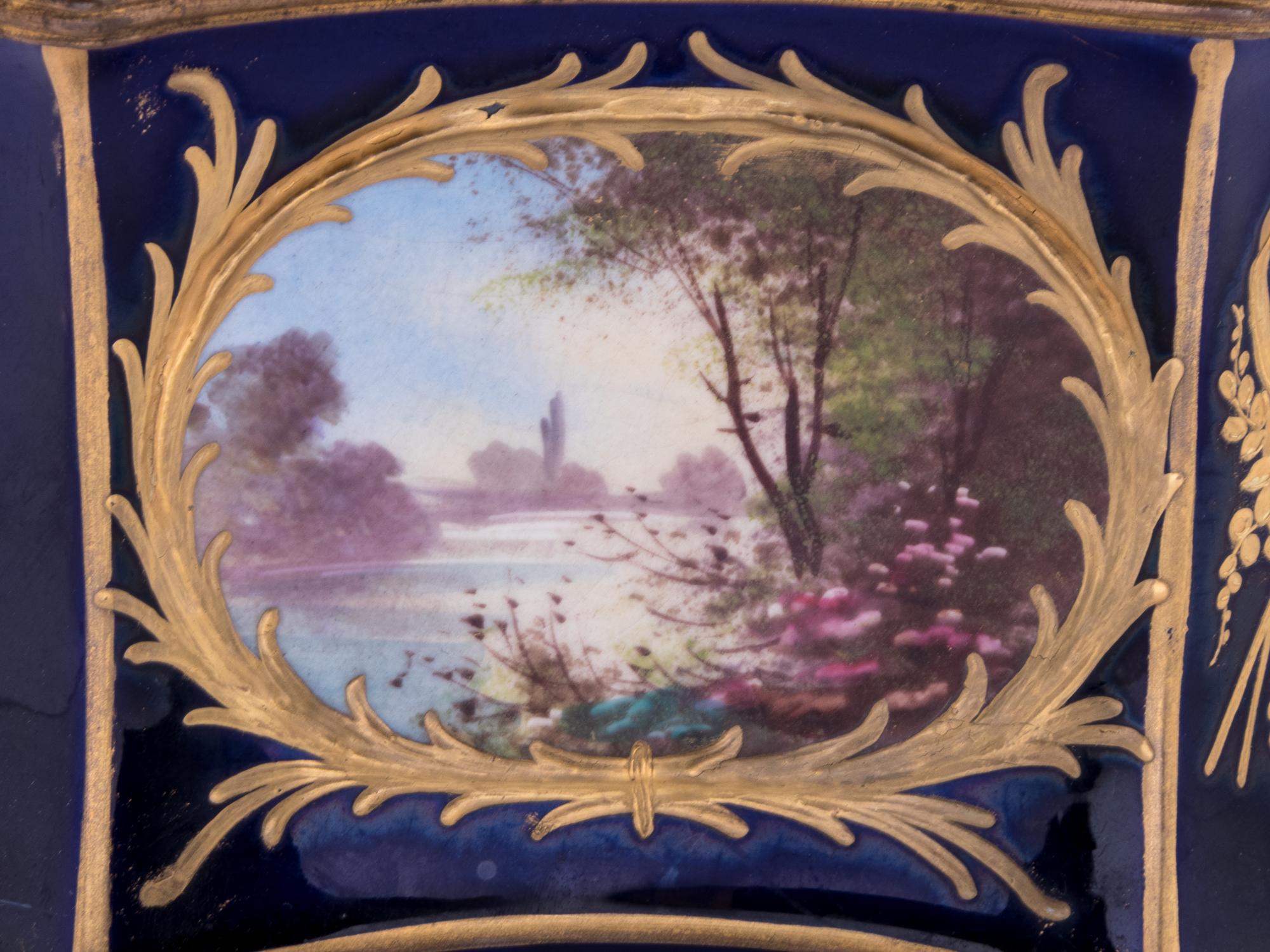 A Sèvres Style Painted and Parcel Gilt Porcelain Table Casket