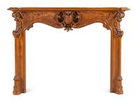 A Louis XV Style Carved Walnut Chimneypiece