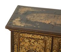 An English Black and Gilt Chinoiserie Decorated Cabinet with Interior Drawers