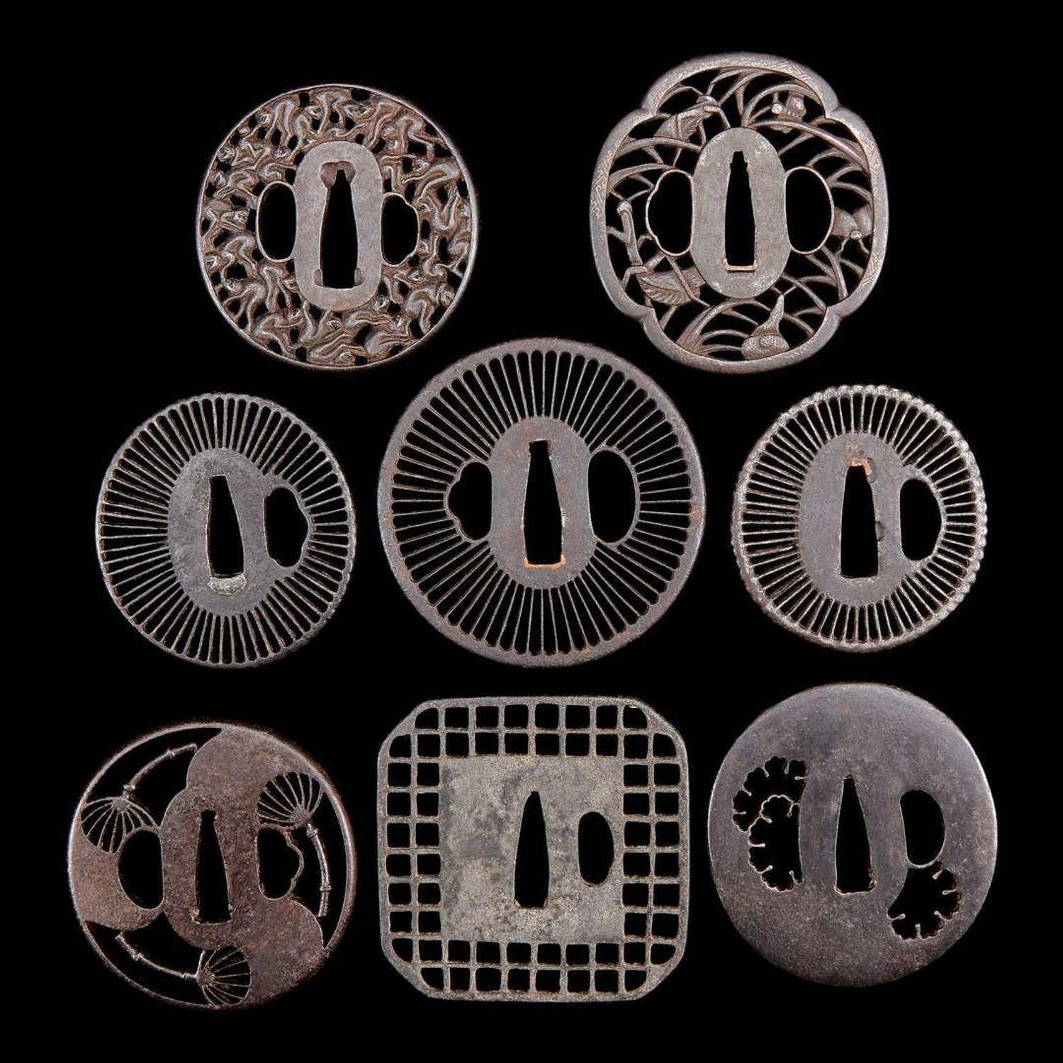 A group of eight Japanese pierced iron and metal tsuba 刀镡一组八件 Edo period ??