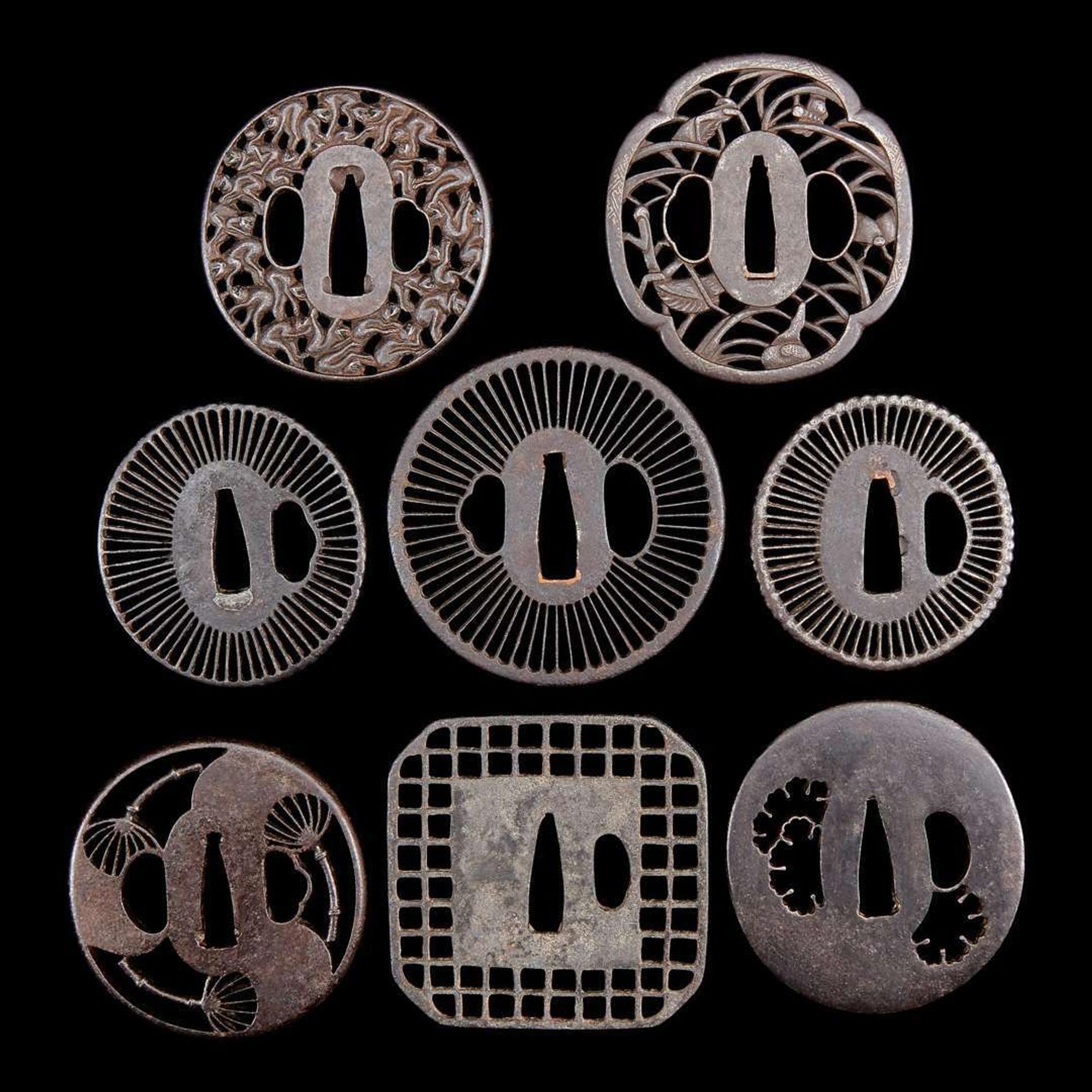 A group of eight Japanese pierced iron and metal tsuba 刀镡一组八件 Edo period ??