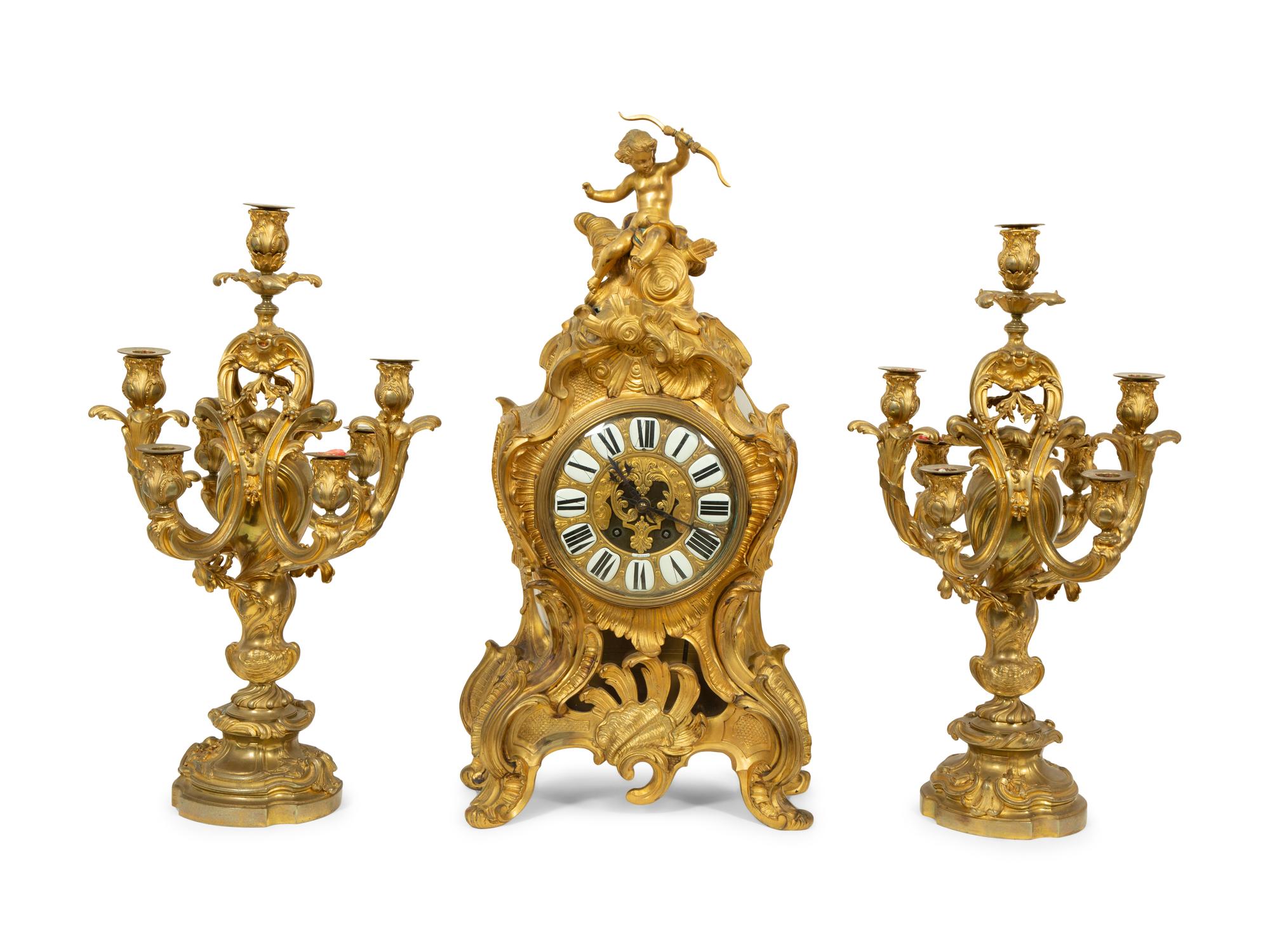 A Louis XV Style Gilt Bronze Clock Garniture