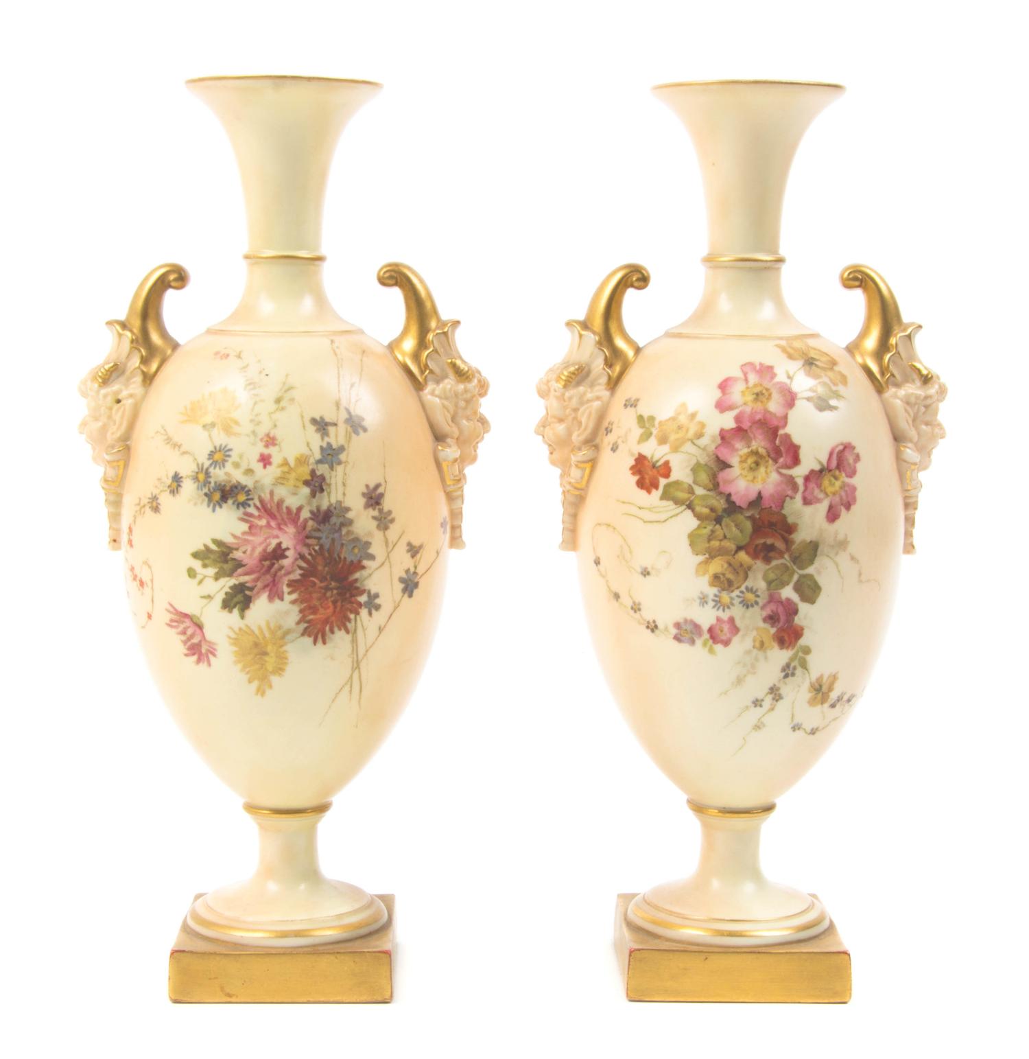 A Pair of Royal Worcester Porcelain Urns, Height 10 1/4 inches.