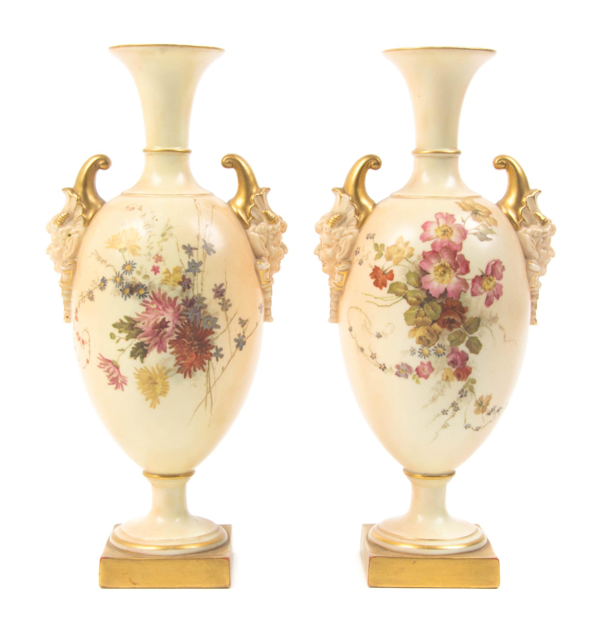 A Pair of Royal Worcester Porcelain Urns, Height 10 1/4 inches.