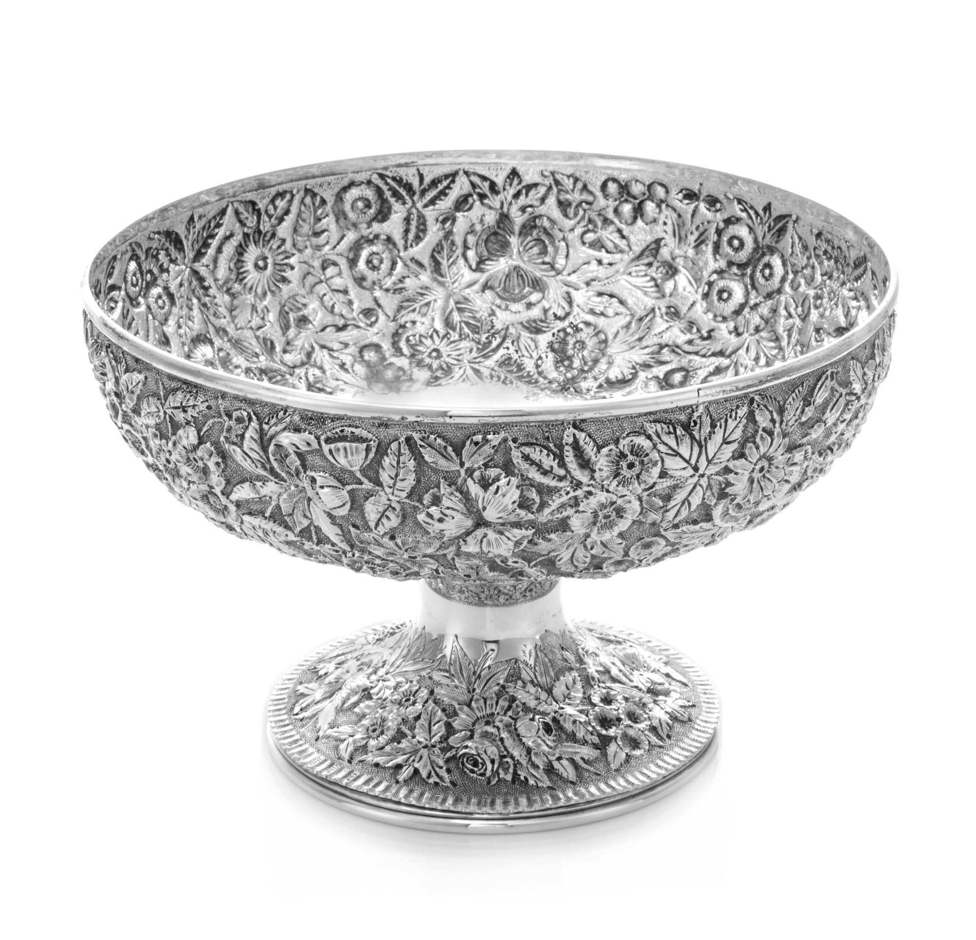 An American Silver Center Bowl, S. Kirk & Son, Baltimore, MD, worked to show floral and foliate repousse decoration, centered with an e