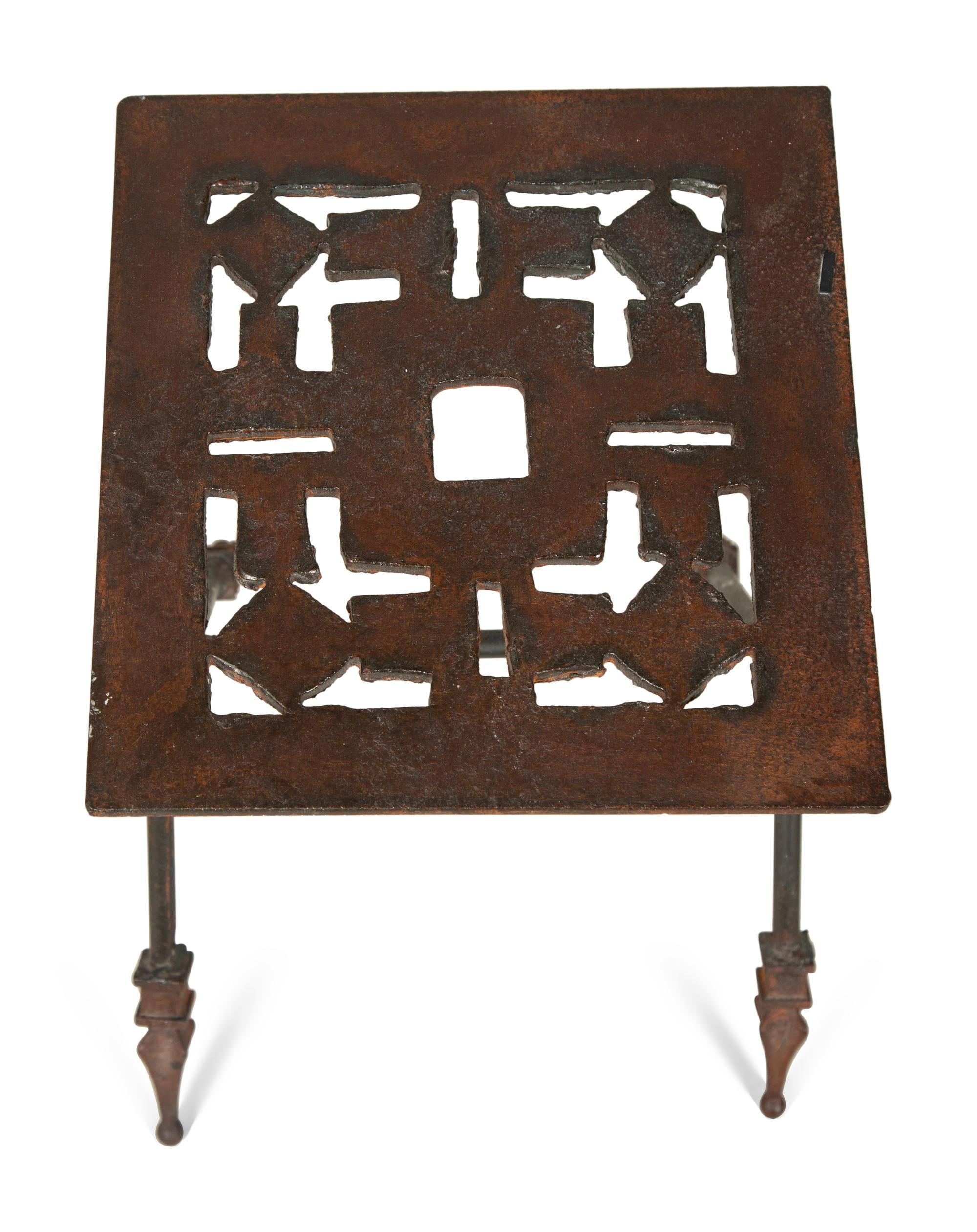 A Set of Three Cut-Out Metal Nesting Tables