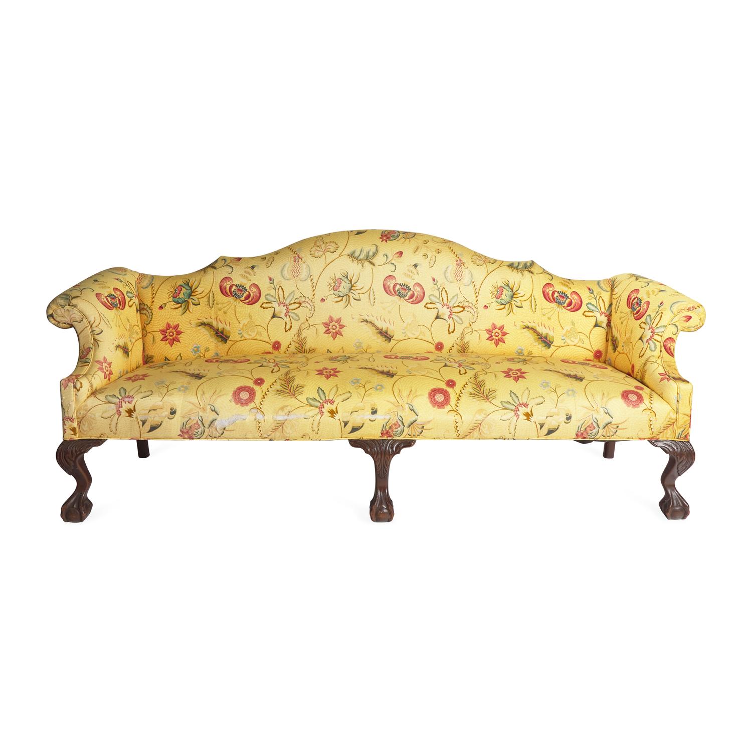 A Chippendale Style Carved Mahogany Camelback Sofa