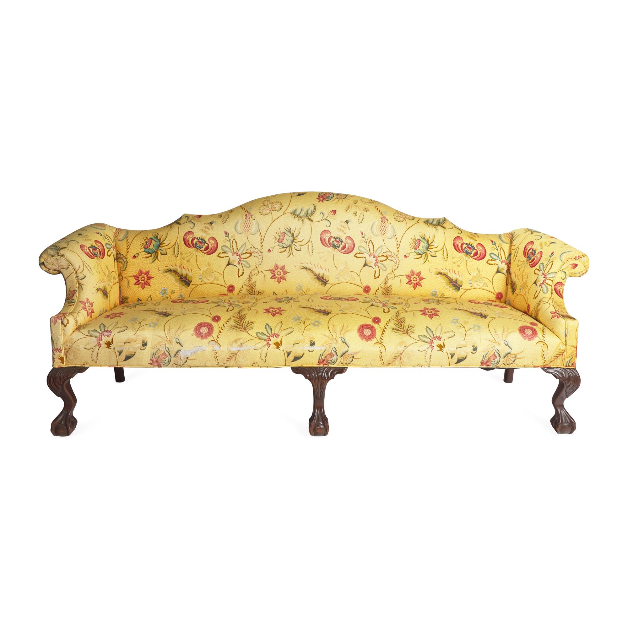 A Chippendale Style Carved Mahogany Camelback Sofa