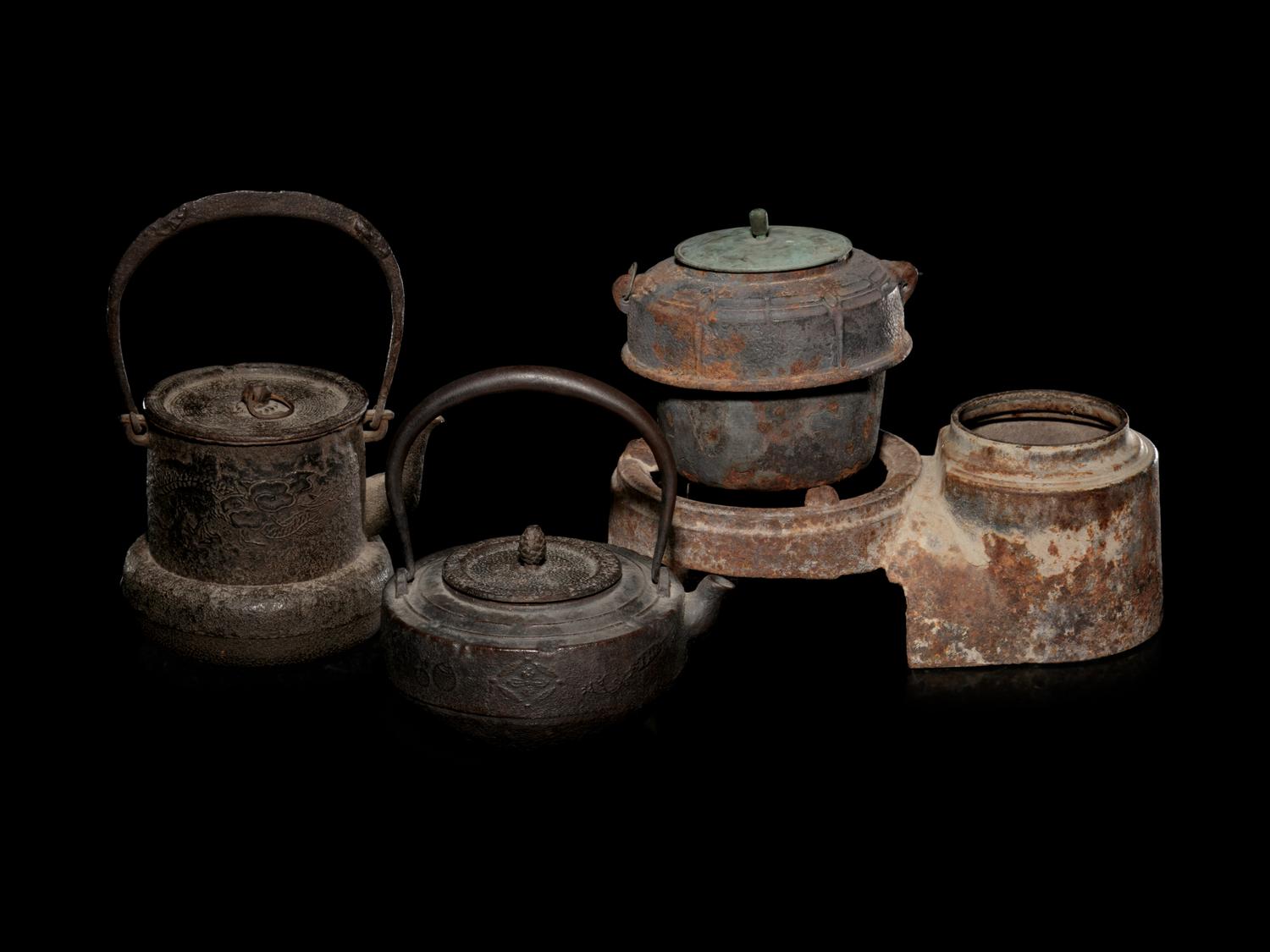 Five Japanese Cast Iron Teapots, Tetsubin , and Burner