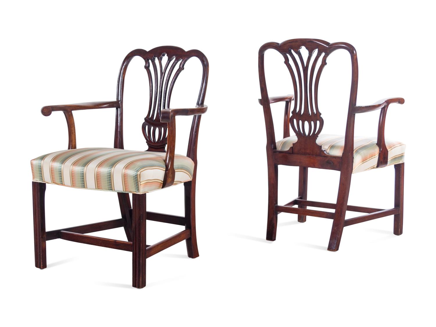A Pair of George III Carved Mahogany Armchairs