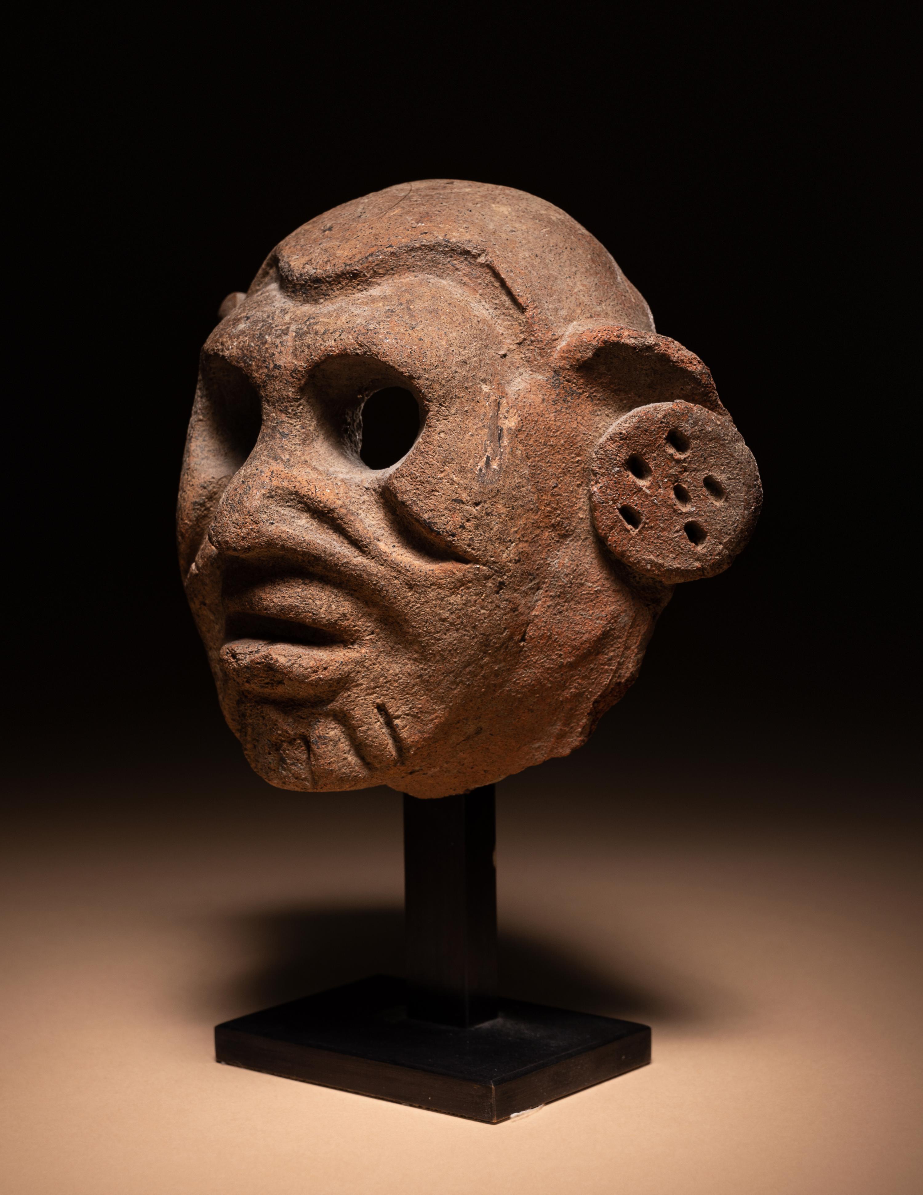 A Maya Terracotta Face Mask