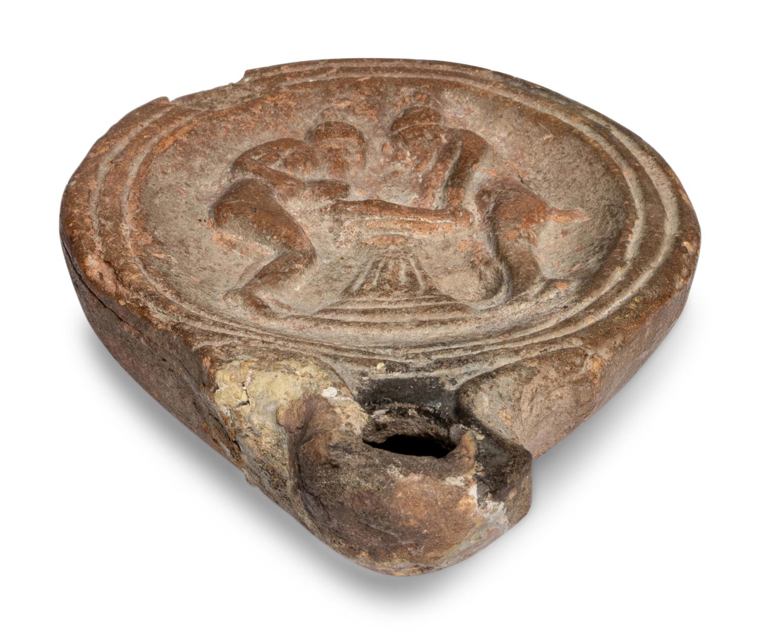 A Roman Terracotta Oil Lamp with Two Women
