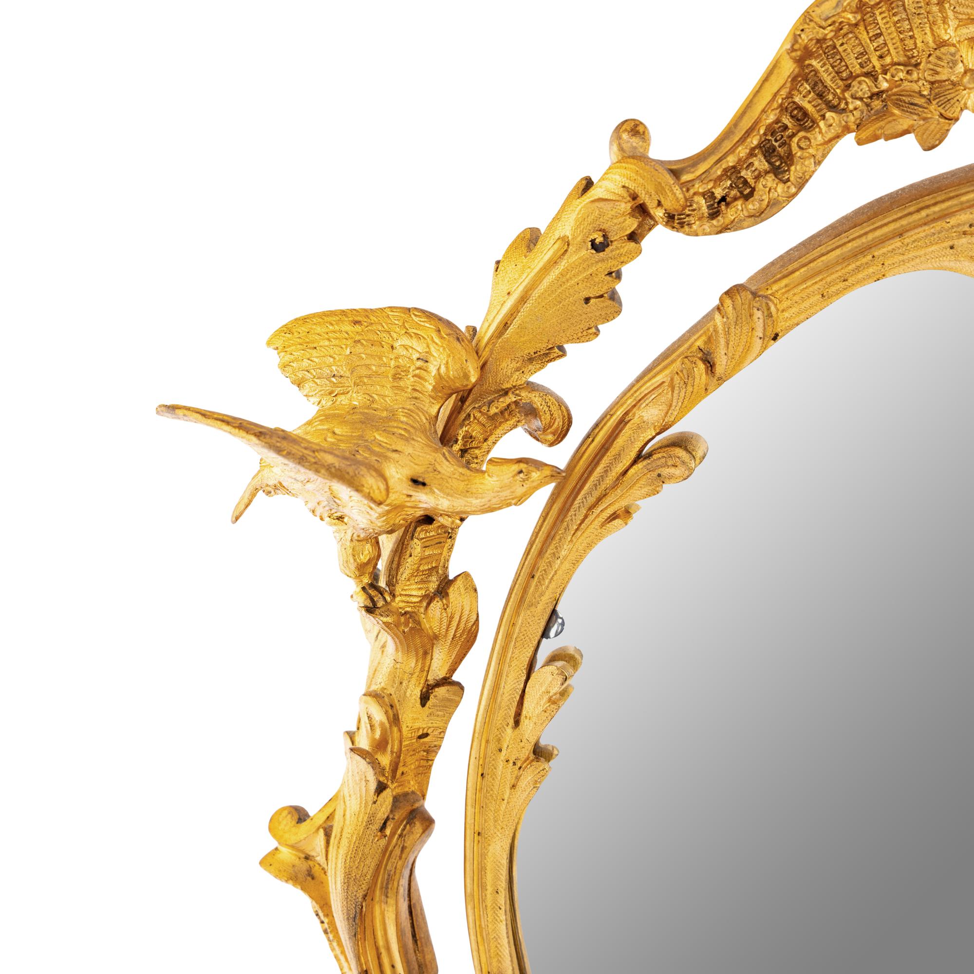 A Rococo Revival Gilt Bronze and Giltwood Dressing Mirror