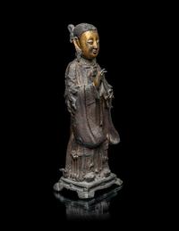 A Chinese Parcel-Gilt Bronze Figure of a Daoist Immortal, Longnv