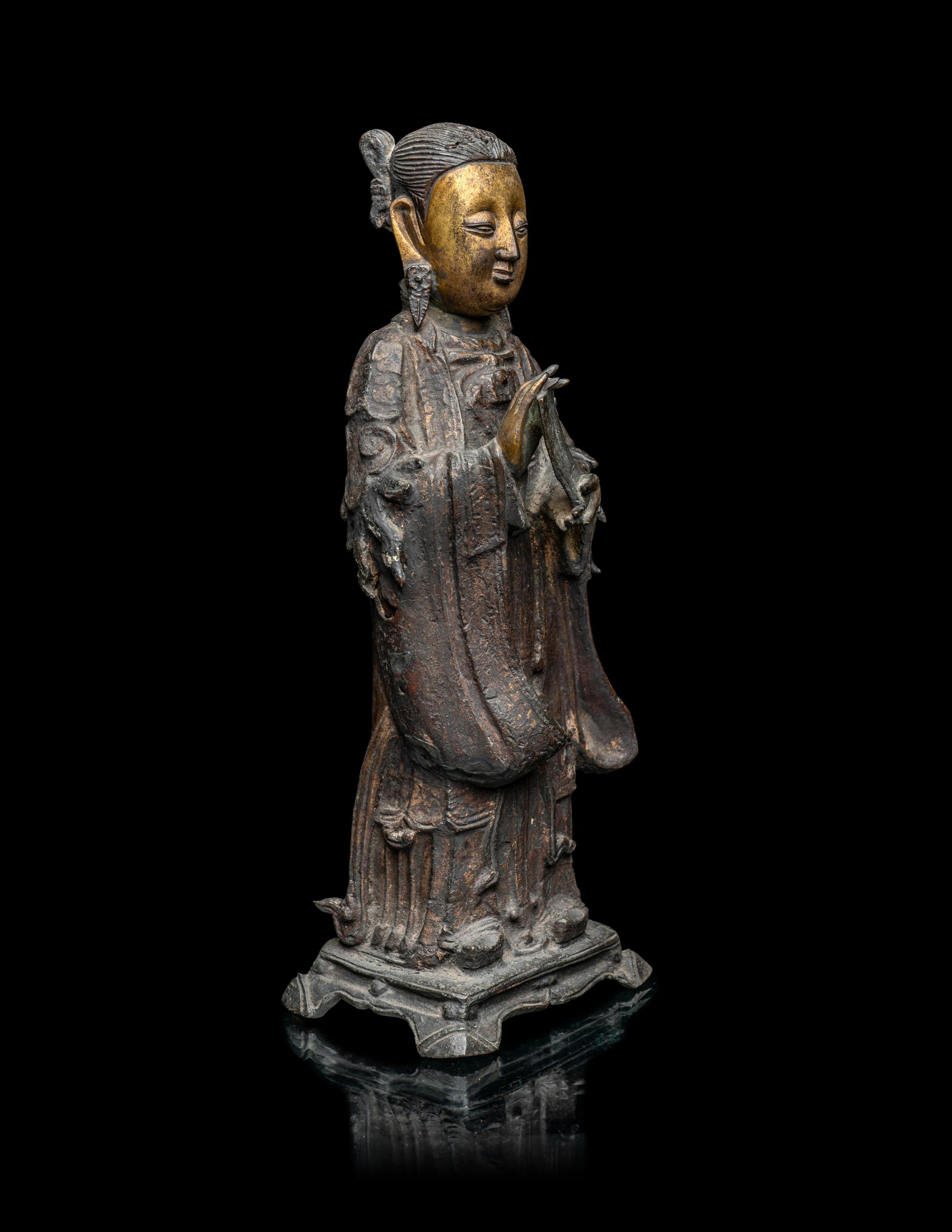 A Chinese Parcel-Gilt Bronze Figure of a Daoist Immortal, Longnv
