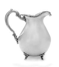 A Silver Water Pitcher, Maker's Mark JDB, having a baluster form body with an S-scroll and foliate decorated rim, raised on foliate fee