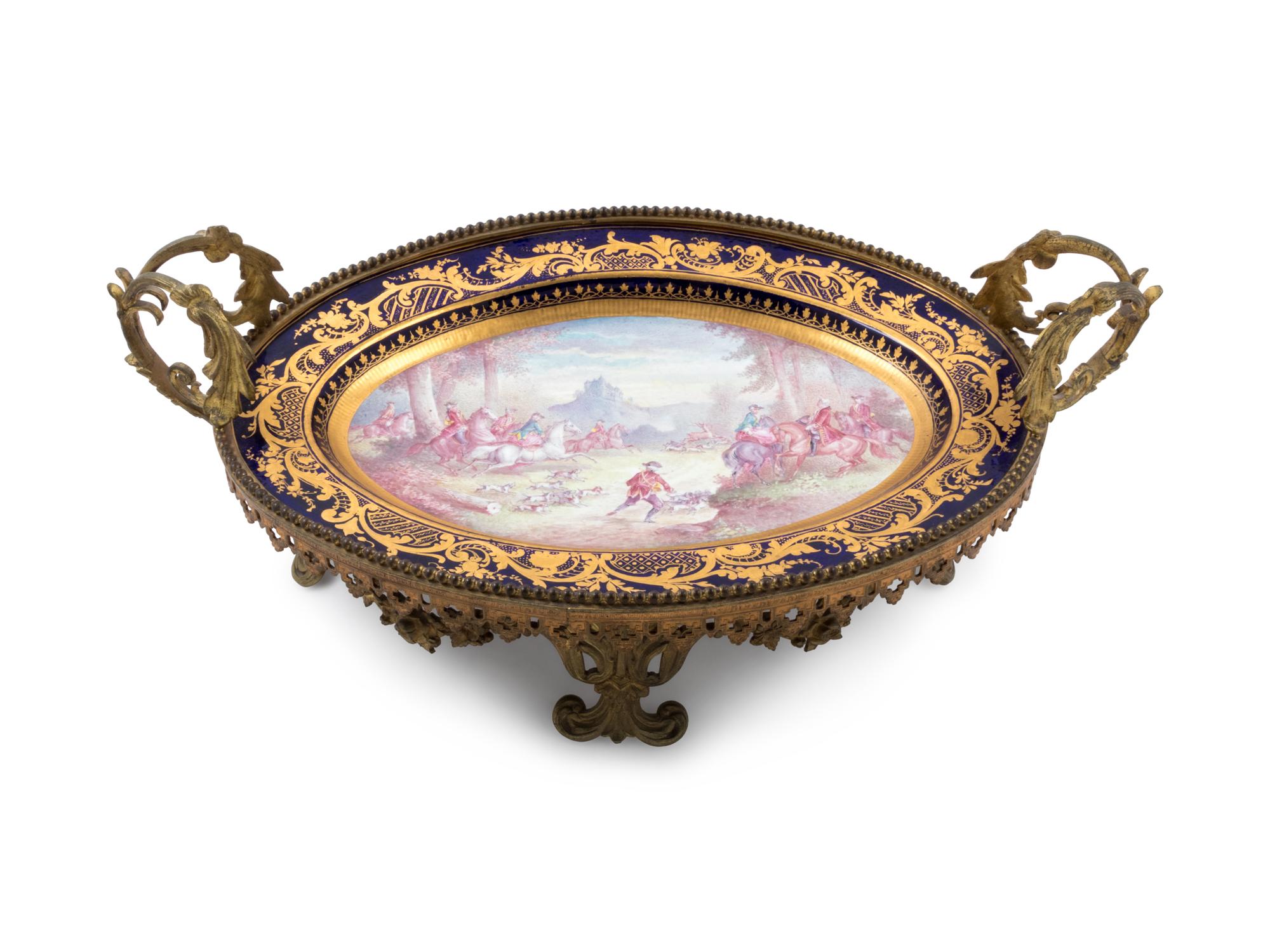 A Sèvres Style Gilt Metal Mounted Painted and Parcel Gilt Porcelain Center Bowl
