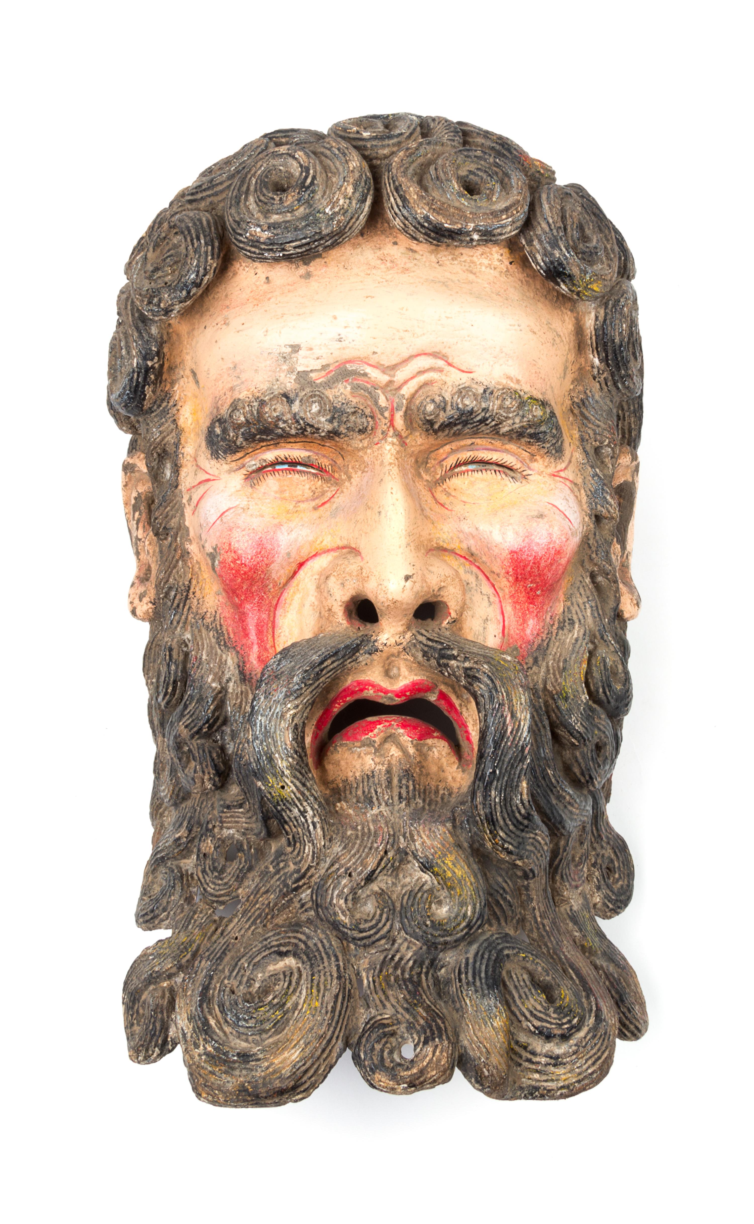 A Mexican Polychromed Wood Mask Height 19 inches.