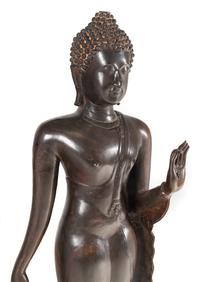 A Large Thai Bronze Figure of Walking Buddha