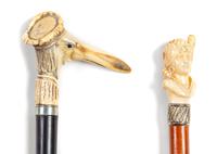 Two Continental Carved Figural Walking Sticks Length of longer 36 inches. — LATE 19TH CENTURY