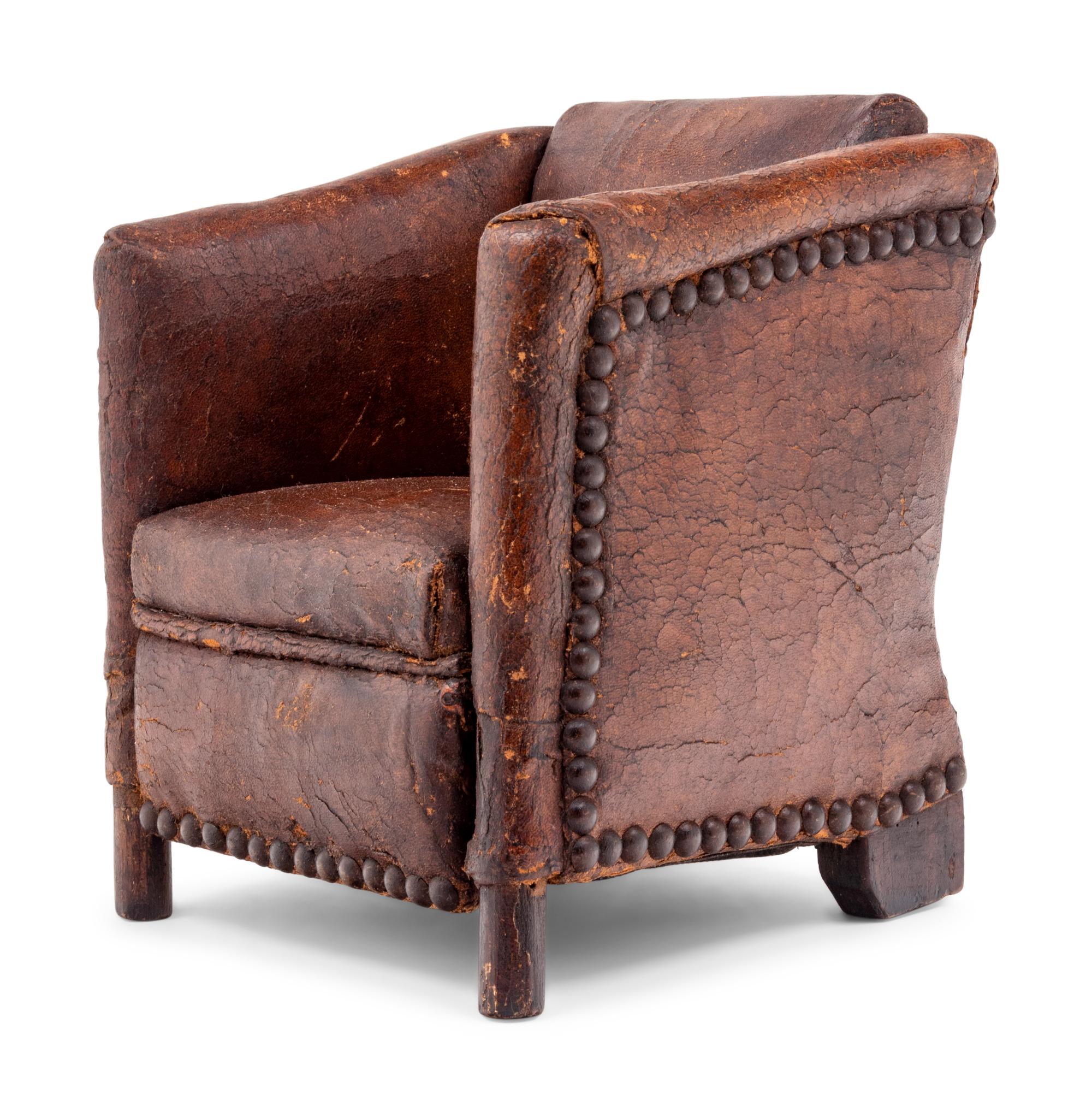 A Diminutive Leather Upholstered Club Chair