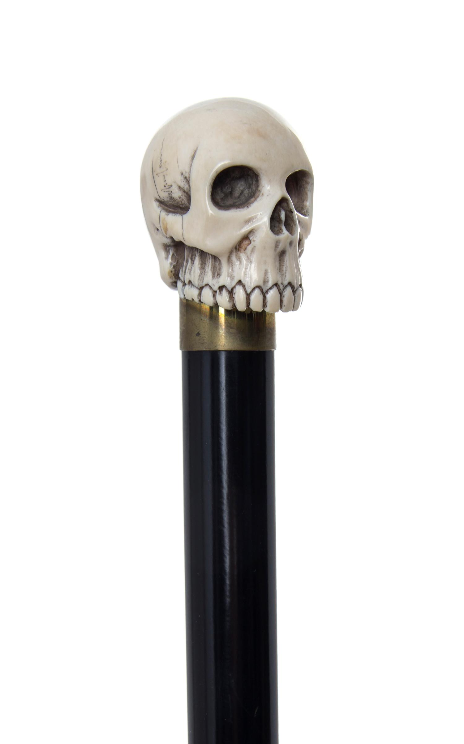 An American Ivory Handled Walking Stick, Diameter of handle 1 3/8 x length overall 34 3/4 inches.